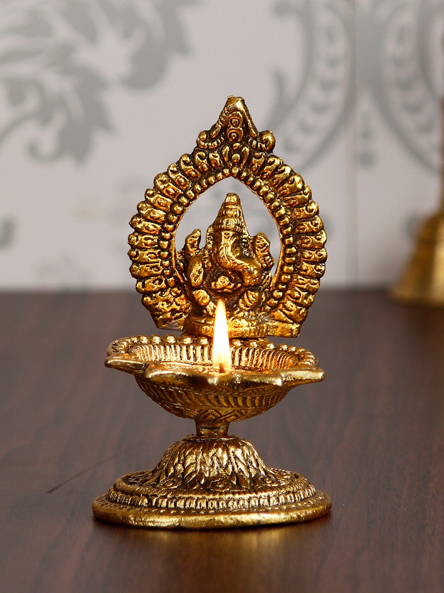 Lord Ganesha Idol with Diya Handcrafted Golden Metal Showpiece 1