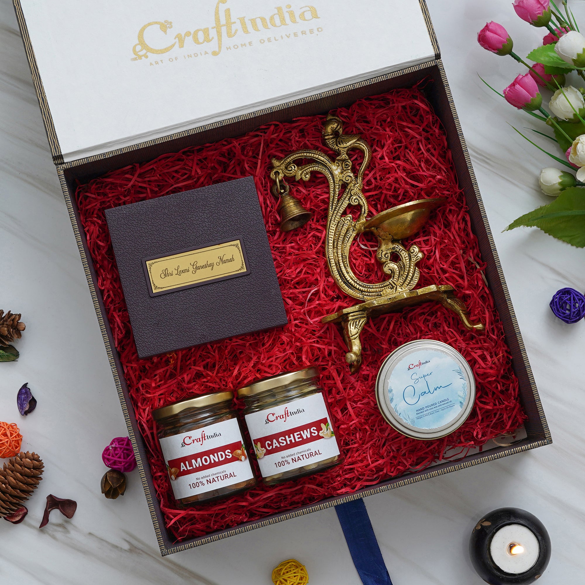 eCraftIndia Exquisite Hamper - Brass Diya with Bells and Stand, Gold Plated Lakshmi Ganesha Photo Frame and Charan Paduka Pooja Box, Super Calm Hand Poured Soya Wax Candle, Almonds, Cashews Dry Fruits Jars