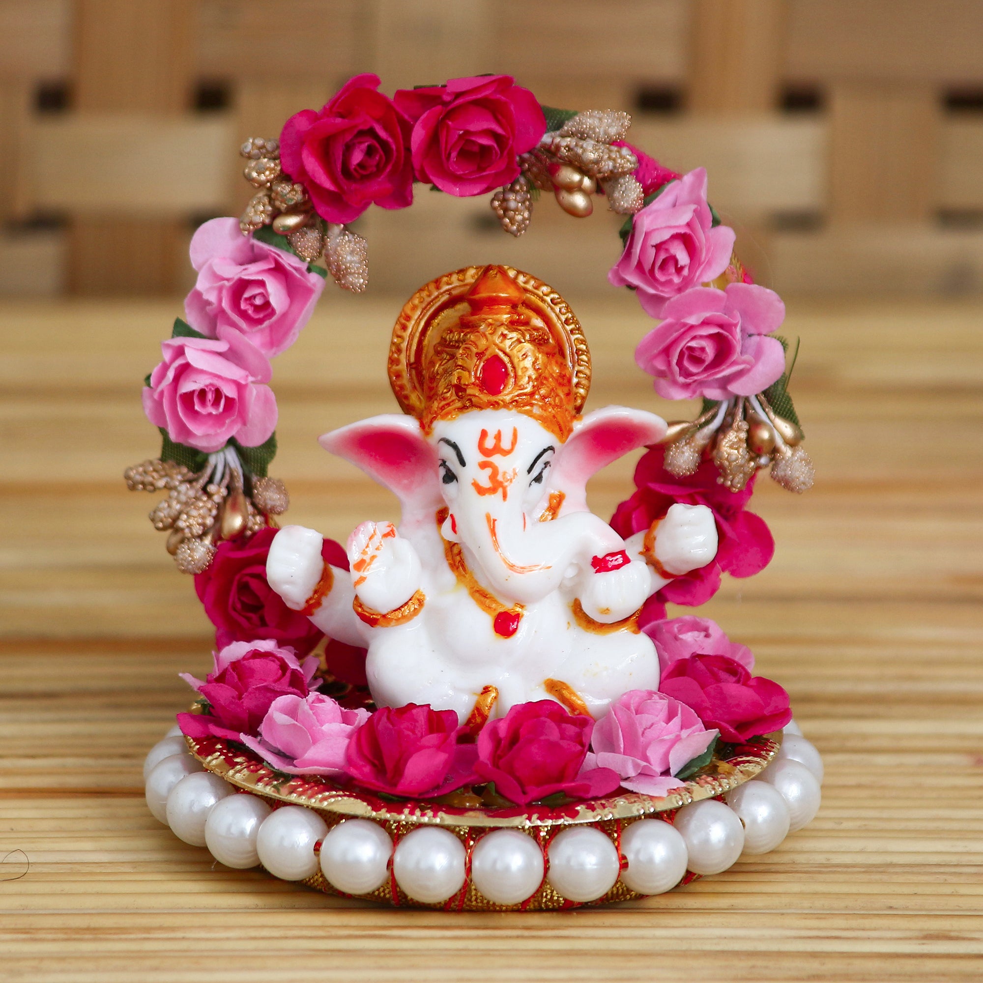 Polyresin Lord Ganesha Idol on Decorative Handcrafted Plate with Throne of Pink and Red Flowers