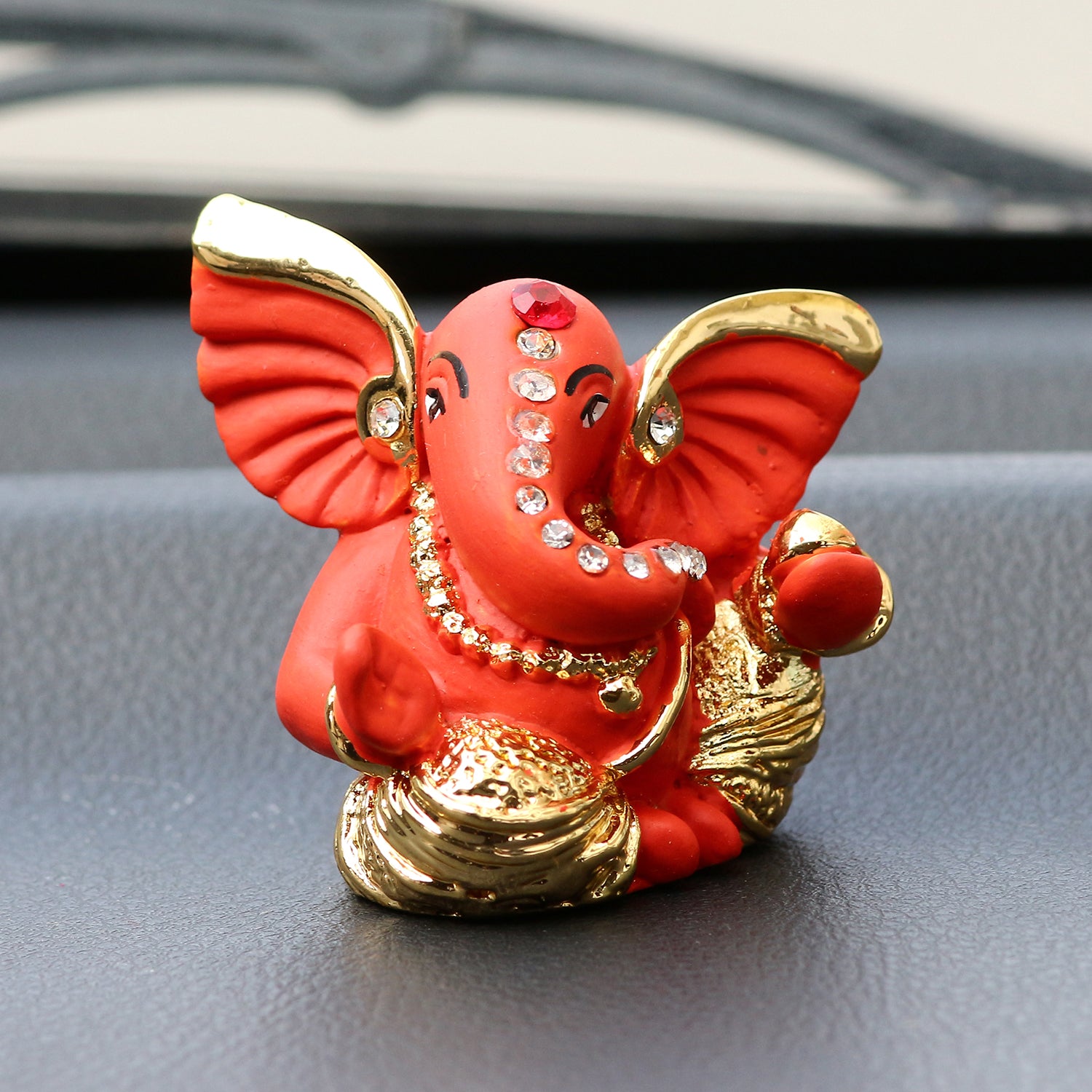 Gold Plated and Orange Polyresin Lord Ganesha Idol for Home, Temple, Office and Car 1