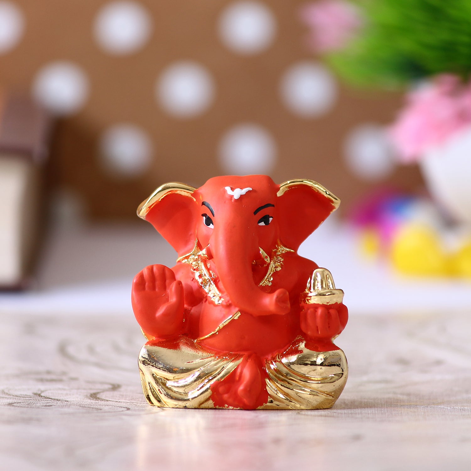 Gold Plated Orange Polyresin Appu Ganesha Idol for Home, Temple, Office and Car Dashboard