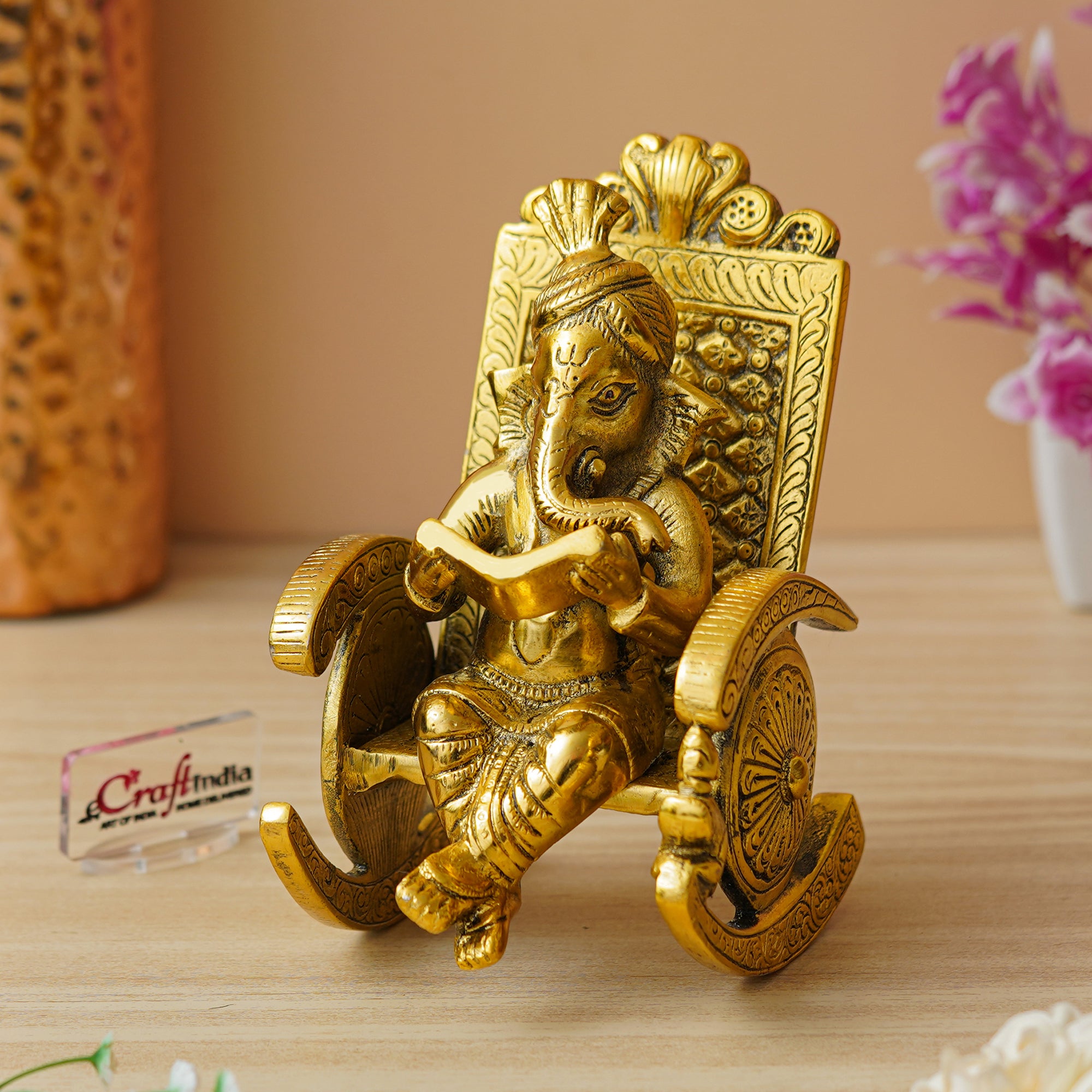 Golden Metal Handcrafted Lord Ganesha Idol Reading Book on Rocking Chair