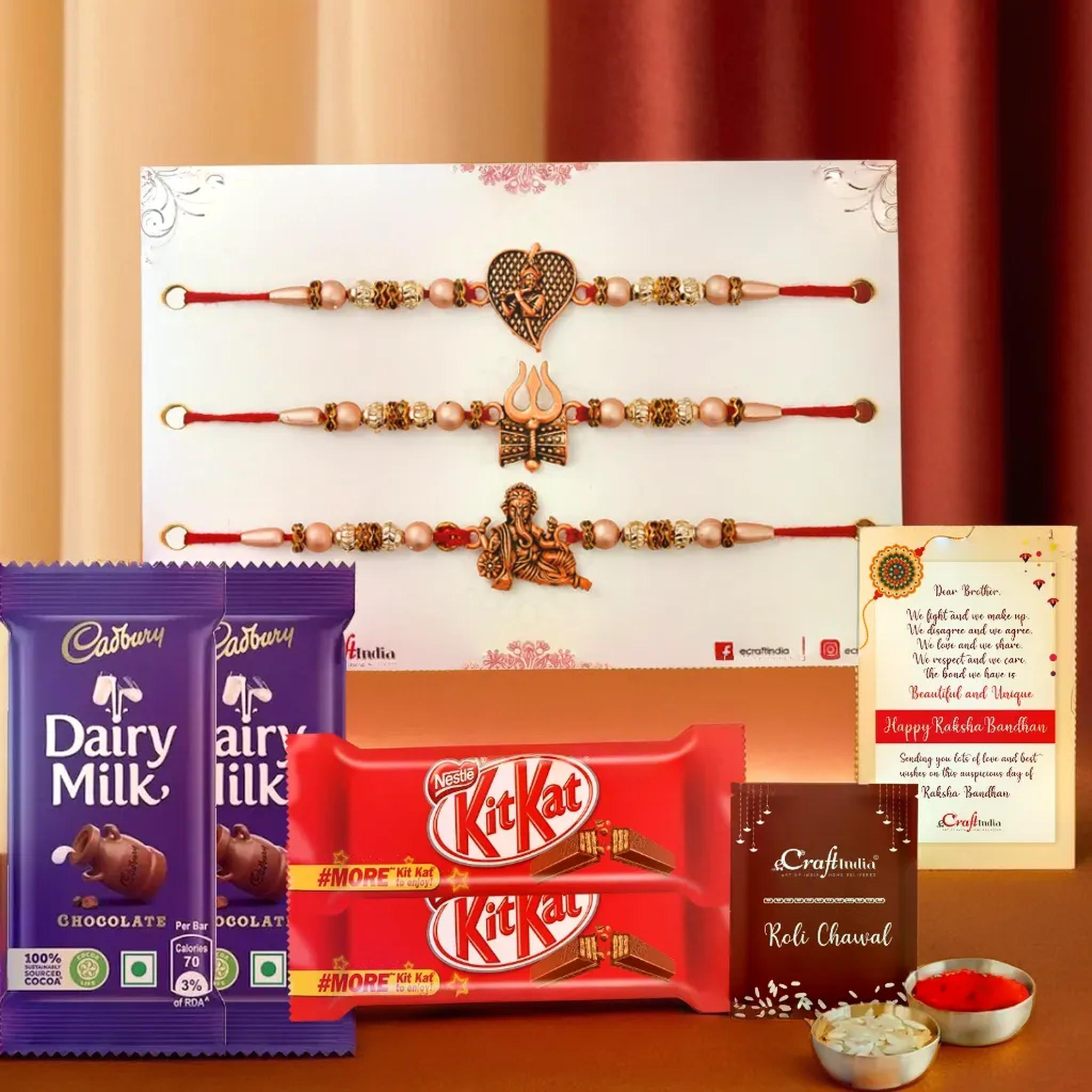 eCraftIndia Set of 3 Trishul with Damru, Ganesha, Krishna Playing Flute Religious Rakhis for Brothers with Chocolate, 2 Cadbury Dairy Milk, 2 Kitkat Chocolate, Rakhi with Chocolate Gift, Roli Chawal