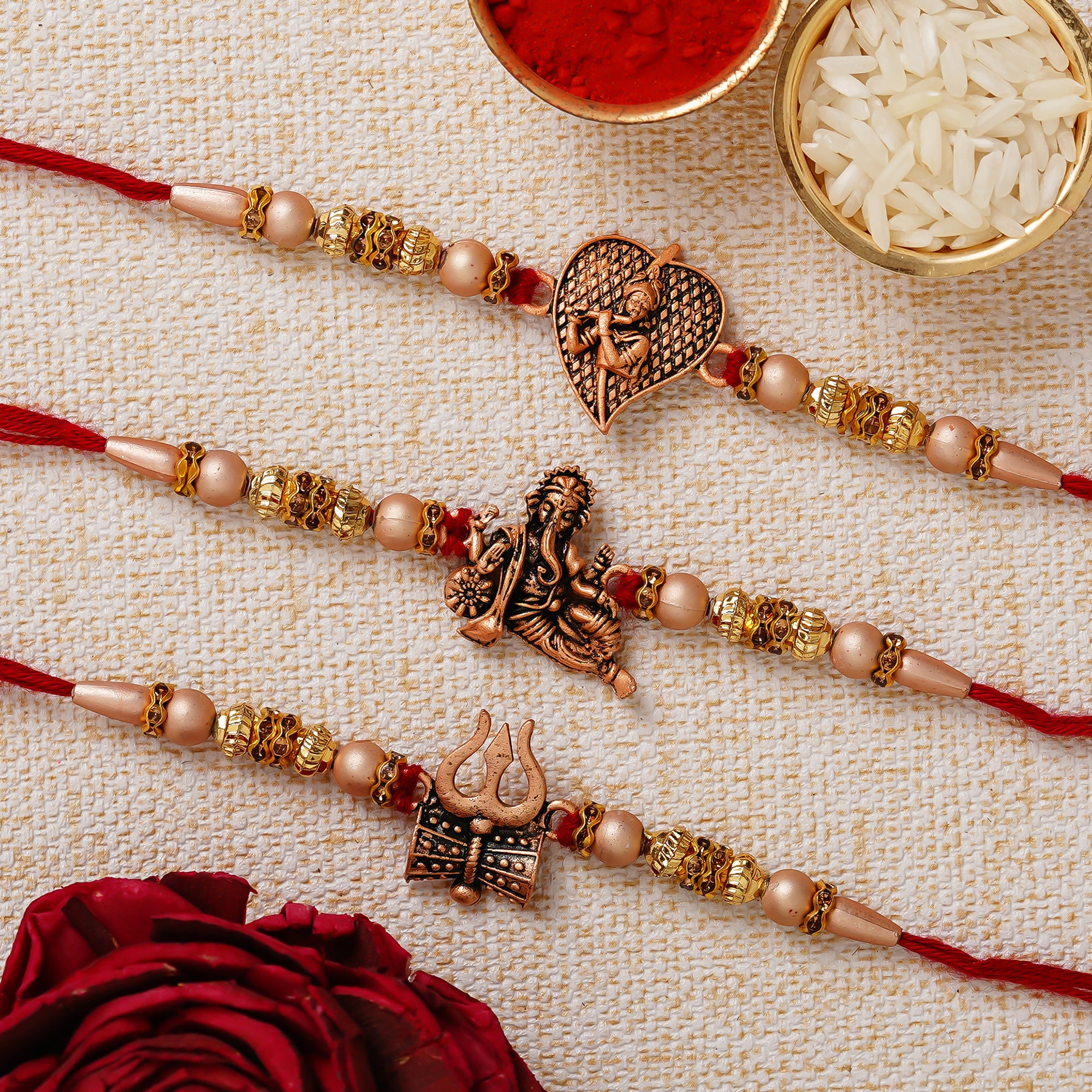 eCraftIndia Set of 3 Trishul with Damru, Ganesha, Krishna Playing Flute Religious Rakhis for Brothers with Chocolate, 2 Cadbury Dairy Milk, 2 Kitkat Chocolate, Rakhi with Chocolate Gift, Roli Chawal 2