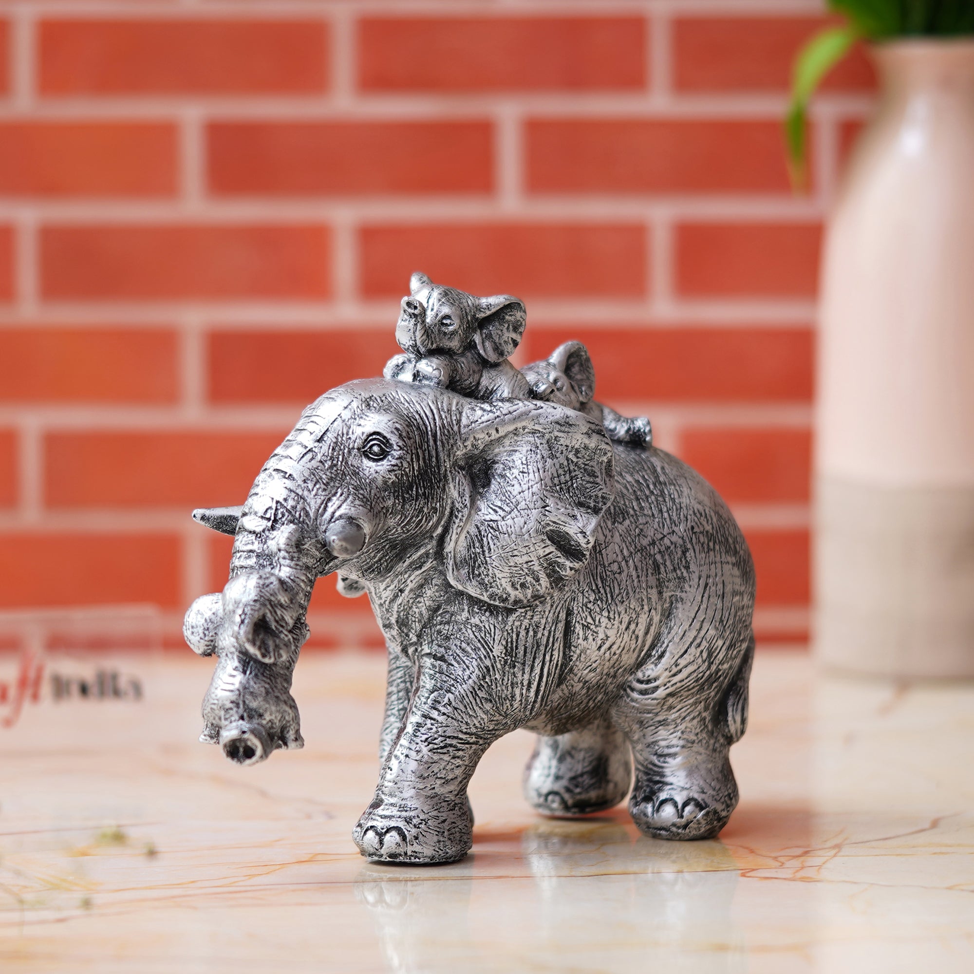 Cute Silver Elephant Statue Carries Three Calves on Its Back and Trunk 4
