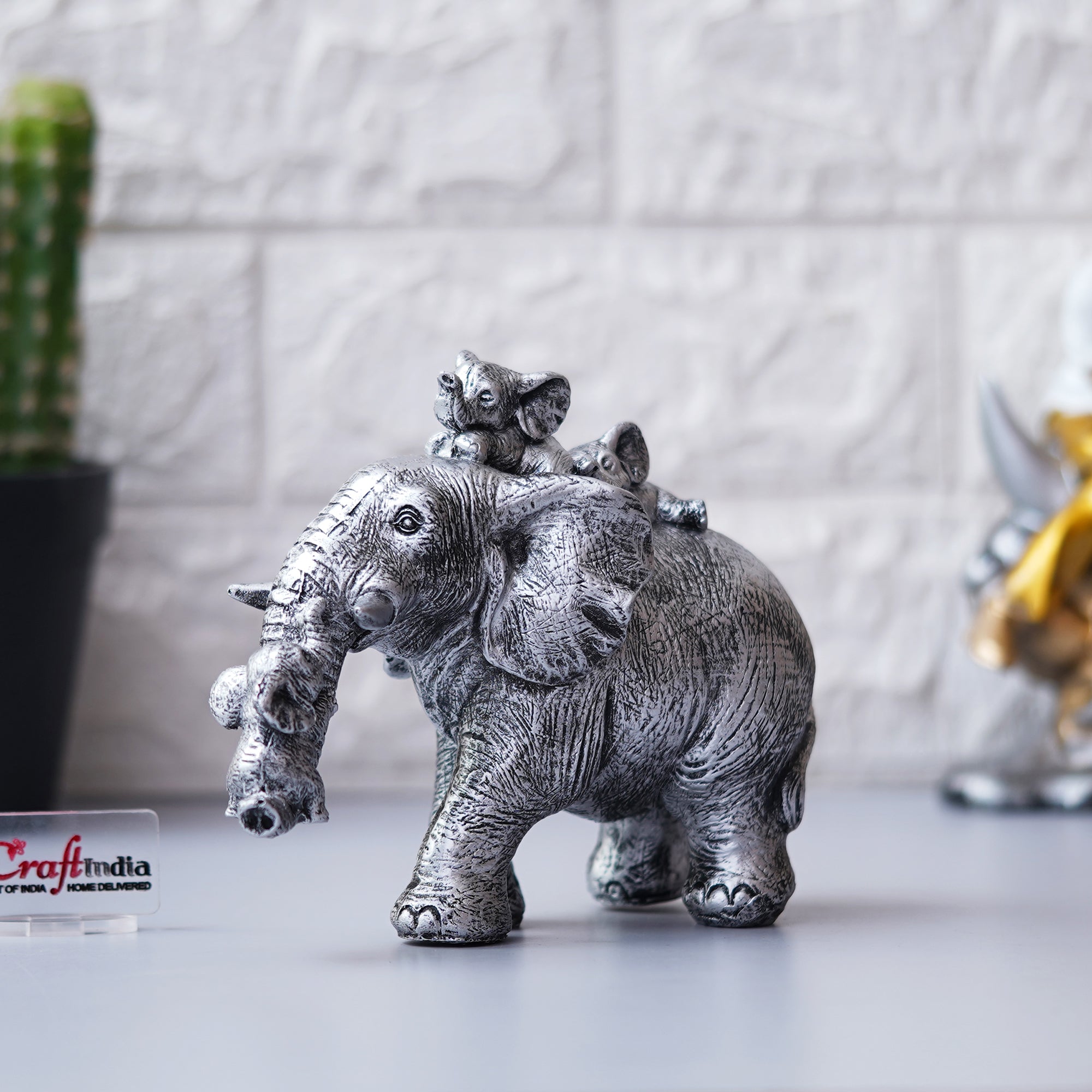 Cute Silver Elephant Statue Carries Three Calves on Its Back and Trunk 5