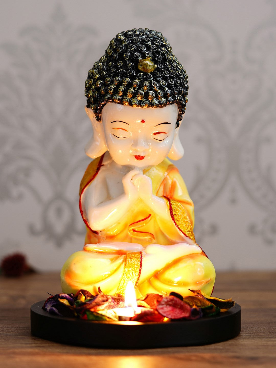 Polyresin Yellow and White Praying Monk Buddha Idol with Wooden Base, Fragranced Petals and Tealight 1