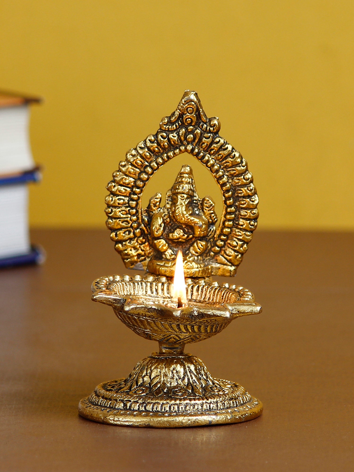 Lord Ganesha Idol with Diya Handcrafted Golden Metal Showpiece