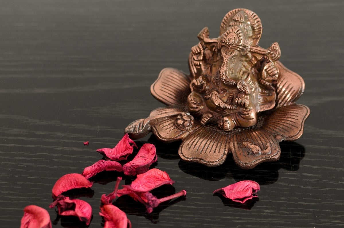 Metal Lord Ganesha Idol On Flower