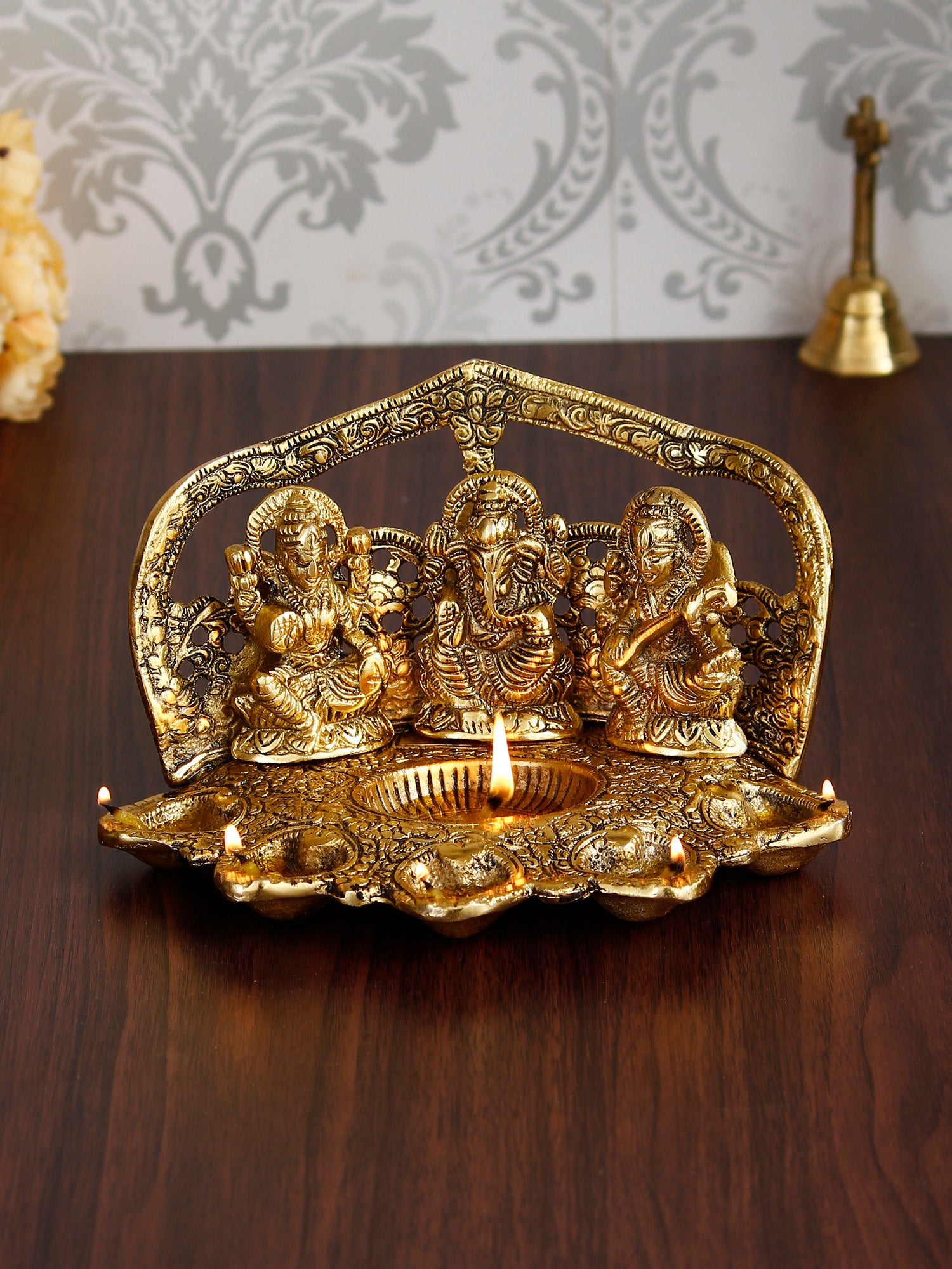 Golden Metal Handcrafted Laxmi Ganesha Saraswati Idols with Diya for 6 Wicks