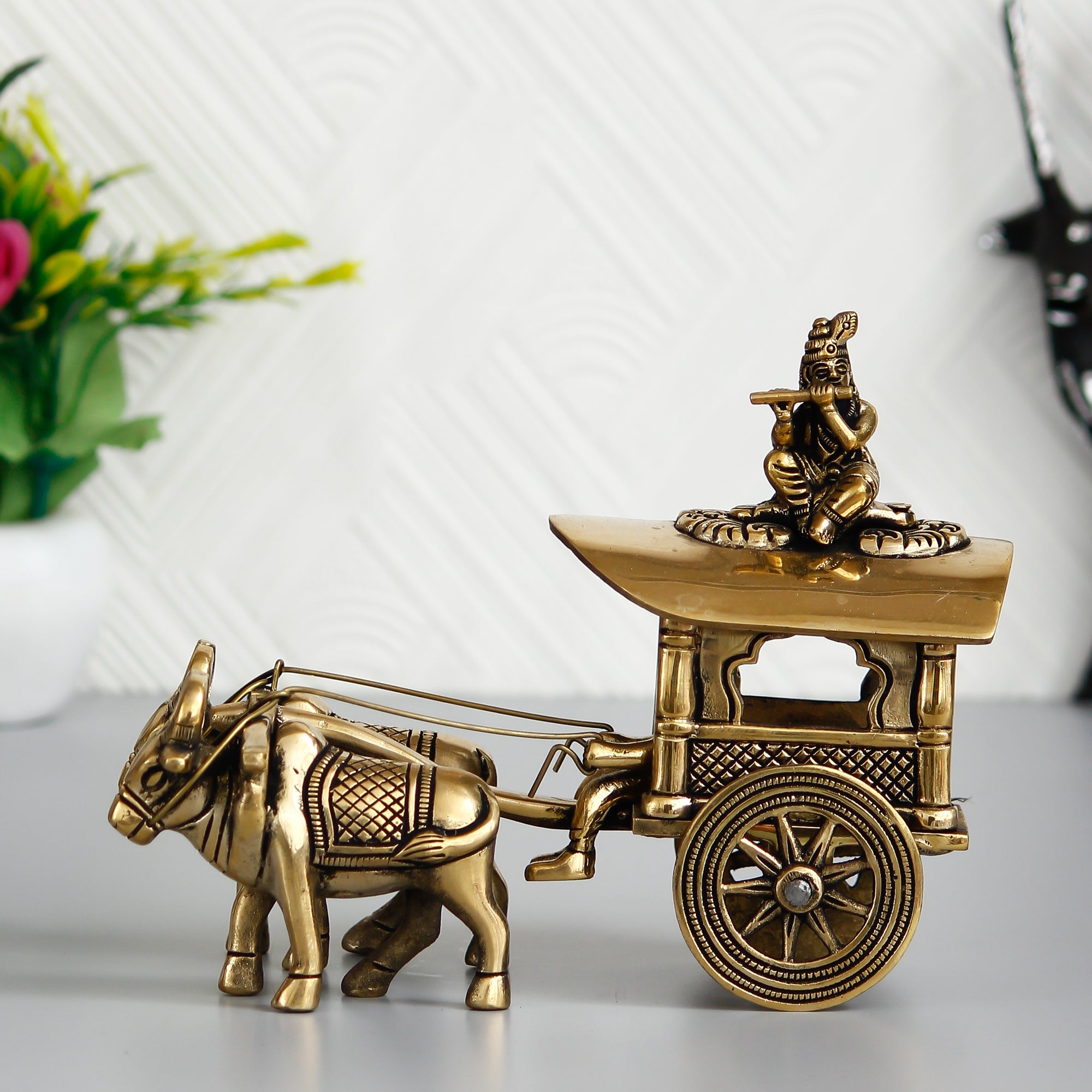 Golden Brass Lord Krishna Idol Sitting In Bullock Cart Showpiece
