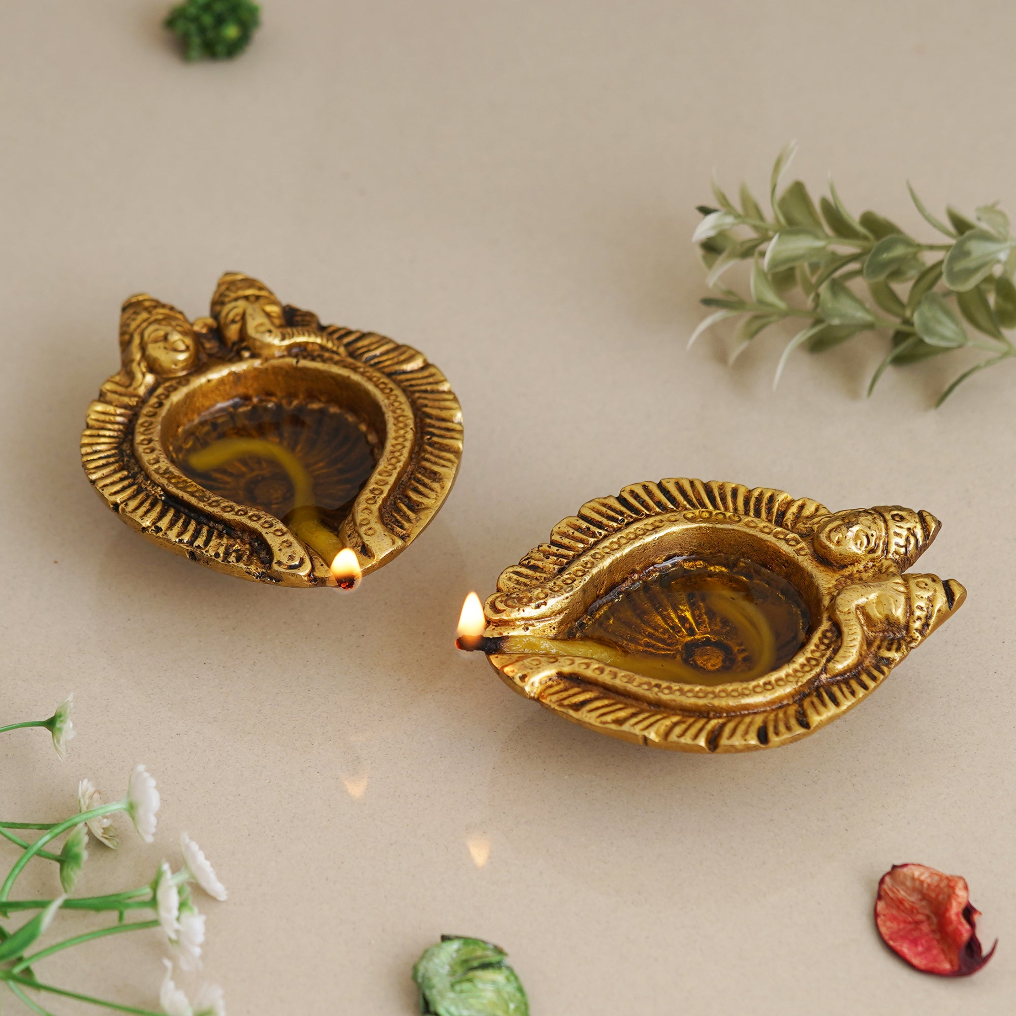 eCraftIndia Set of 2 Golden Handcrafted Goddess Lakshmi and Lord Ganesha Design Auspicious Brass Diyas 1