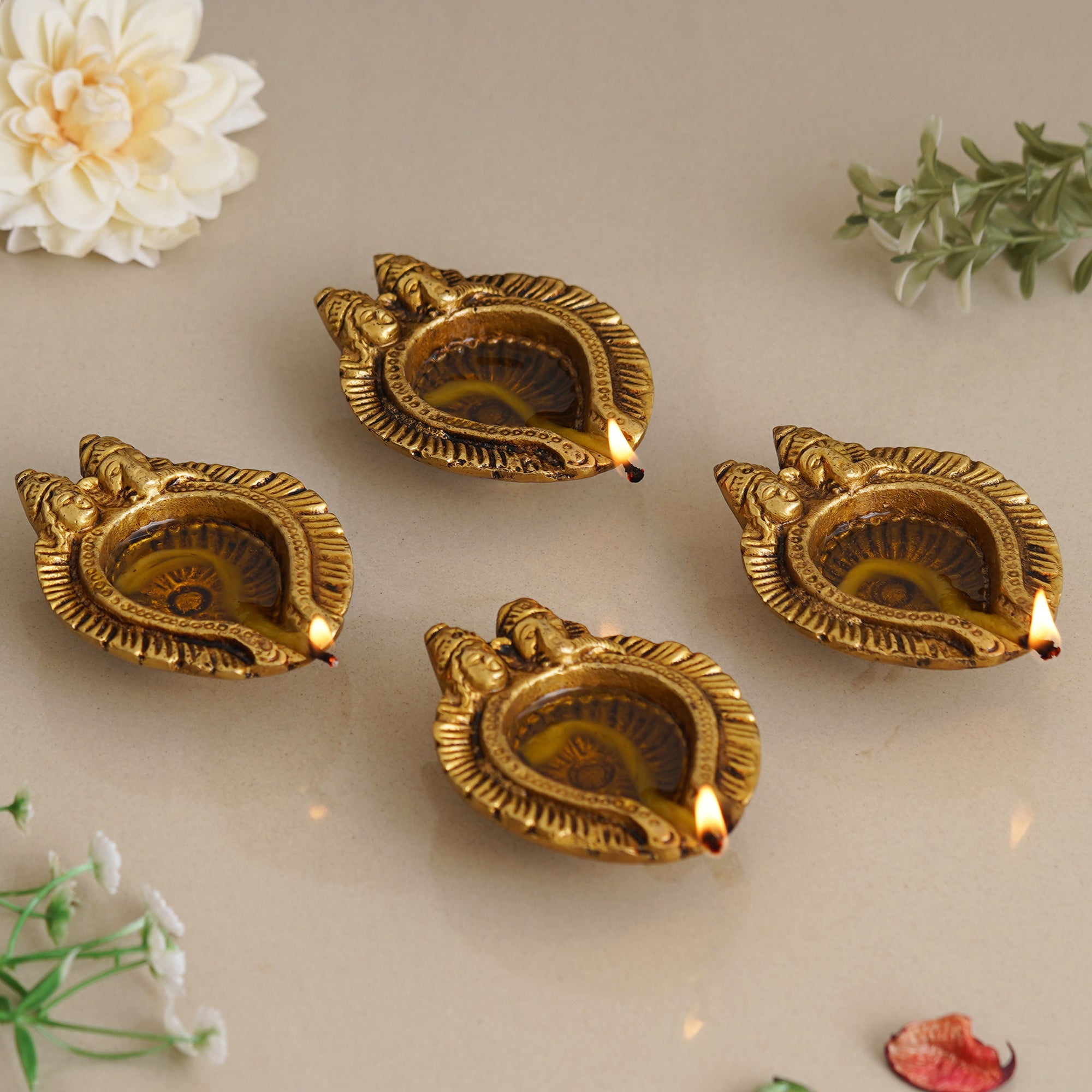 eCraftIndia Set of 4 Golden Handcrafted Goddess Lakshmi and Lord Ganesha Design Auspicious Brass Diyas