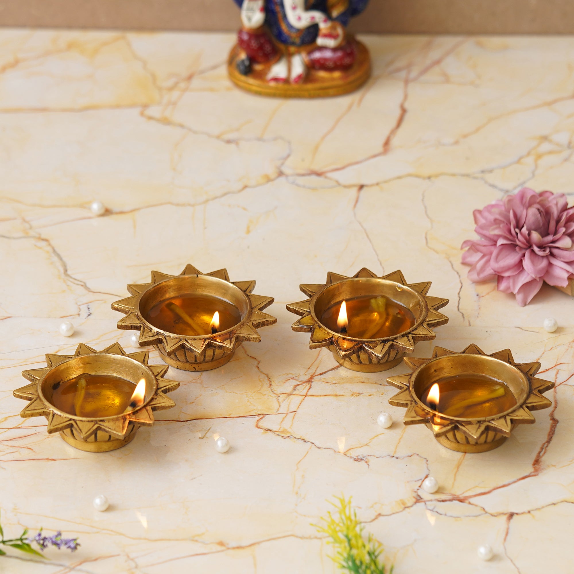 eCraftIndia Set of 4 Golden Sun Shaped Decorative Brass Diyas