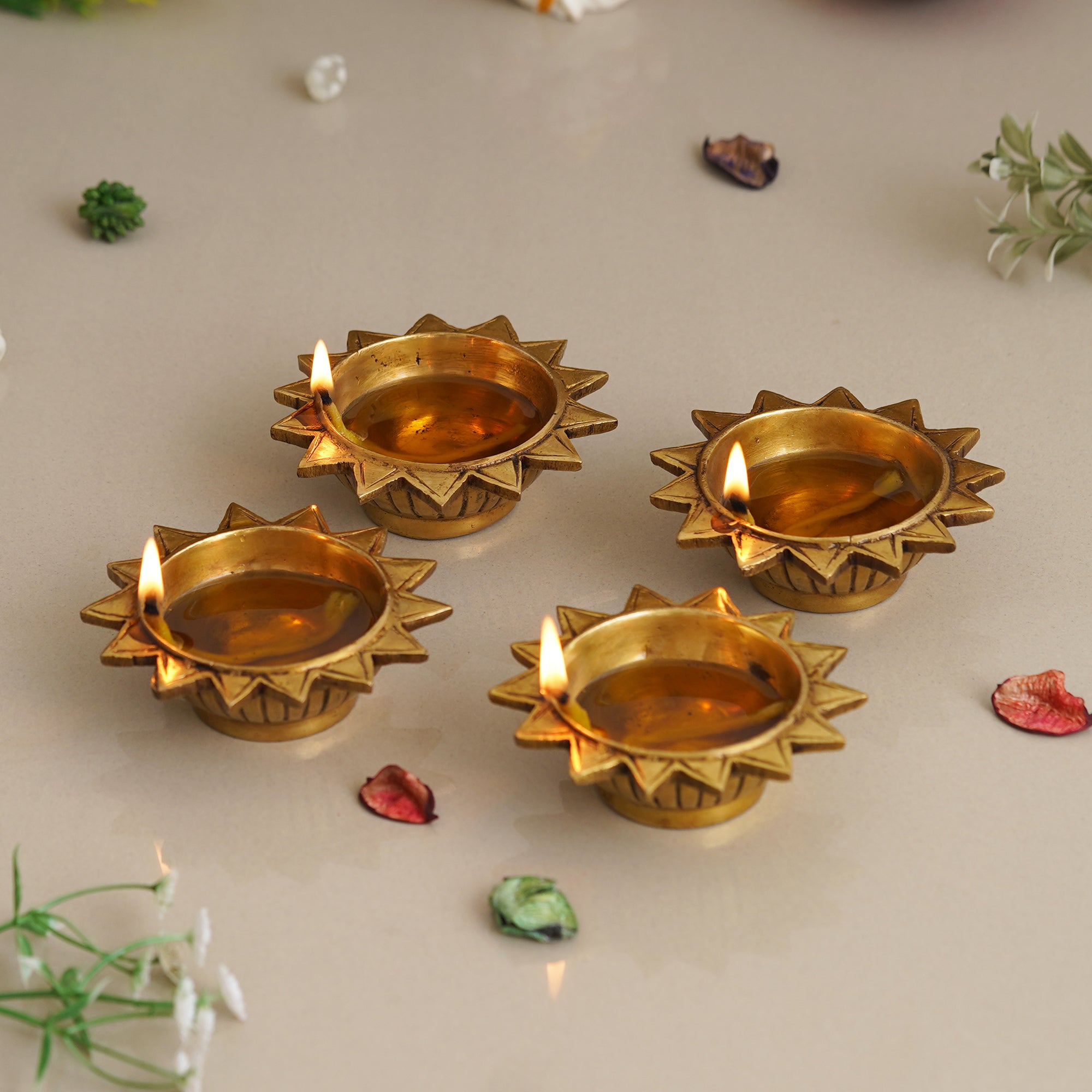 eCraftIndia Set of 4 Golden Sun Shaped Decorative Brass Diyas 1