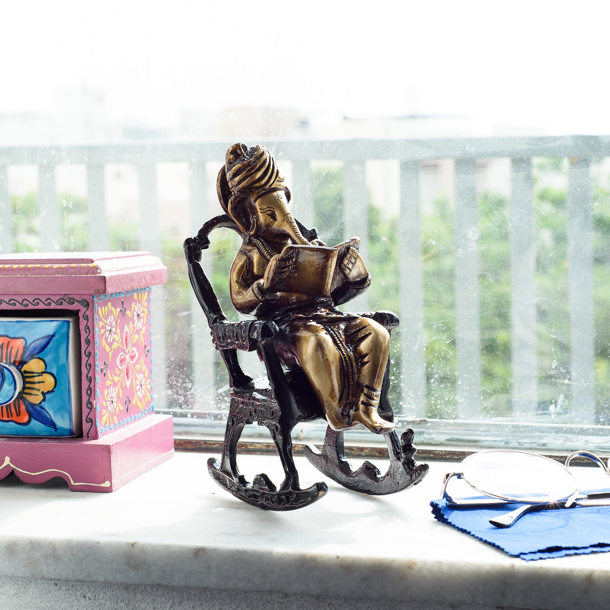 Brown Brass Lord Ganesha Idol On Rocking Chair Showpiece 1