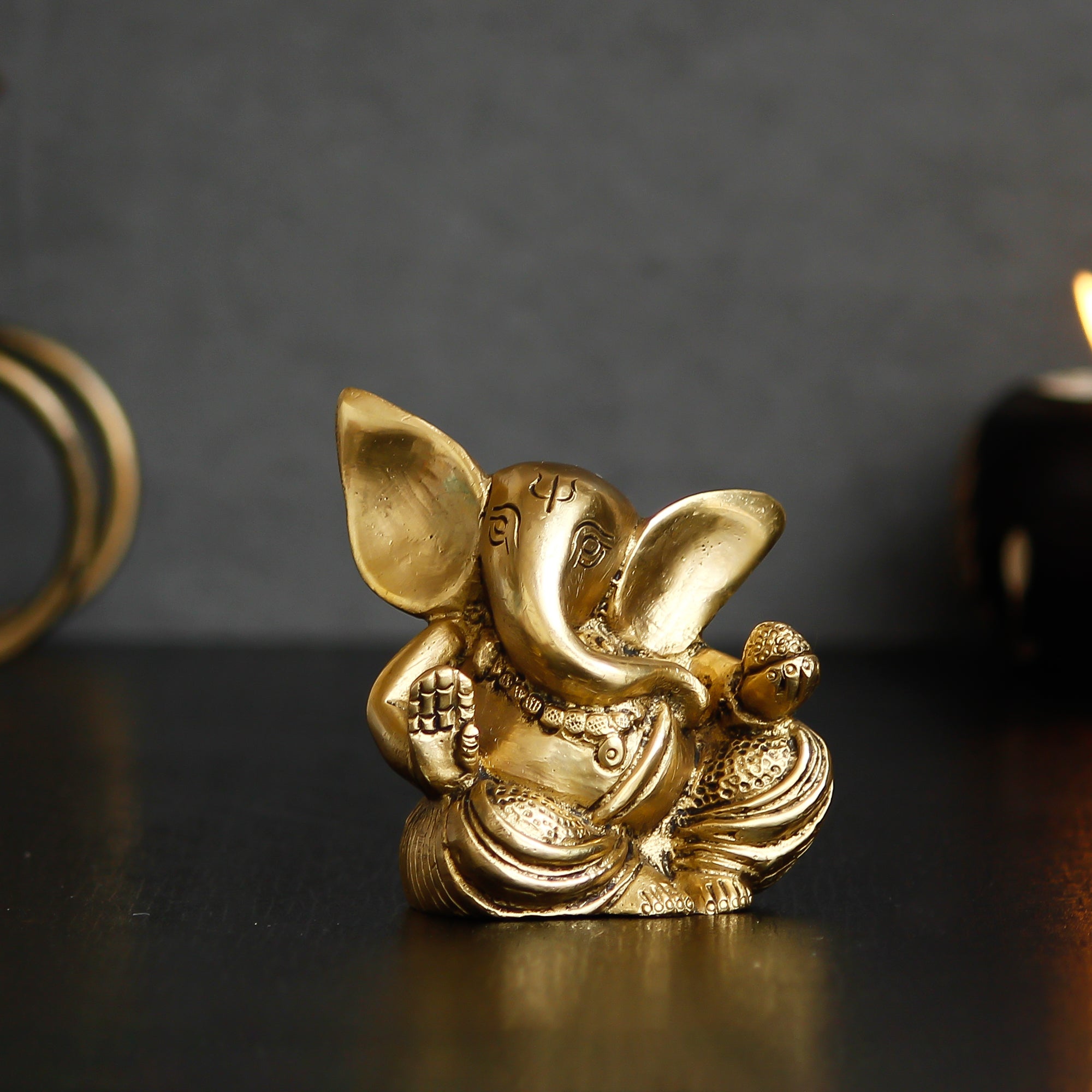 Golden Brass Blessing Lord Ganesha Idol With Modak 1