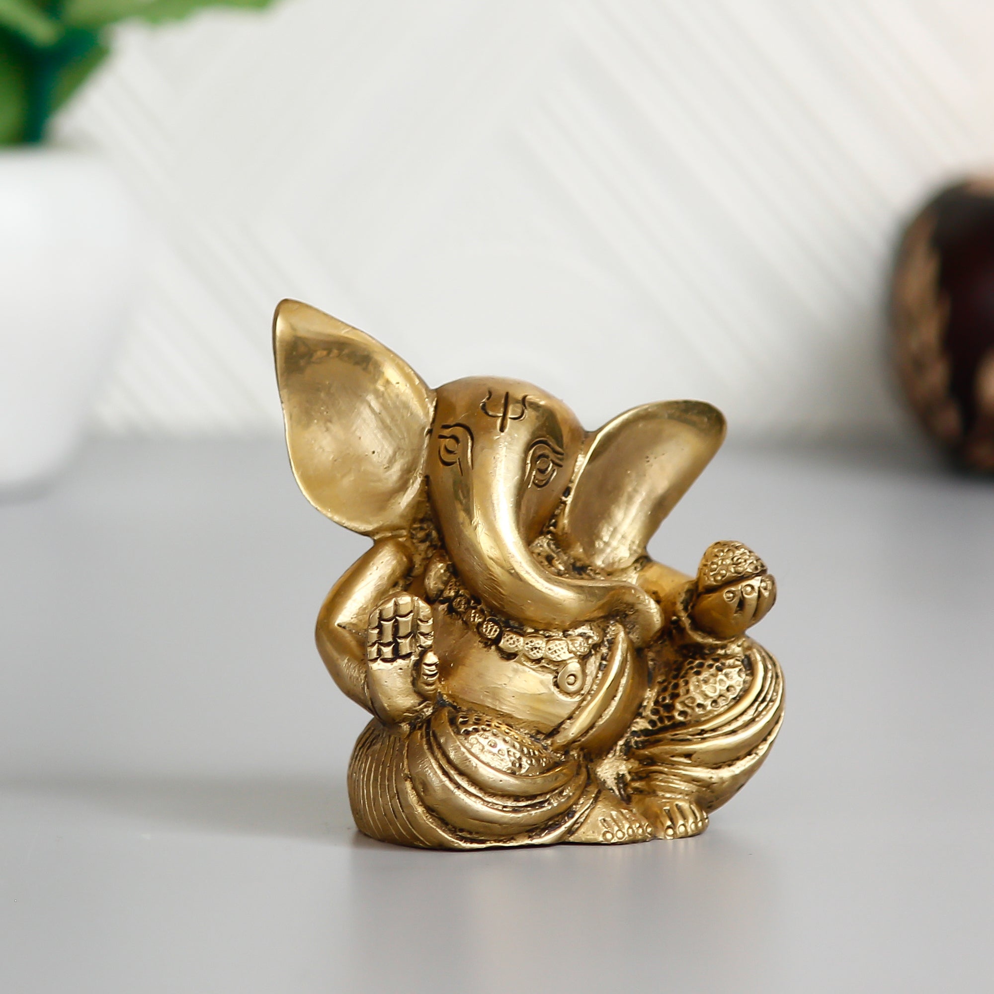 Golden Brass Blessing Lord Ganesha Idol With Modak