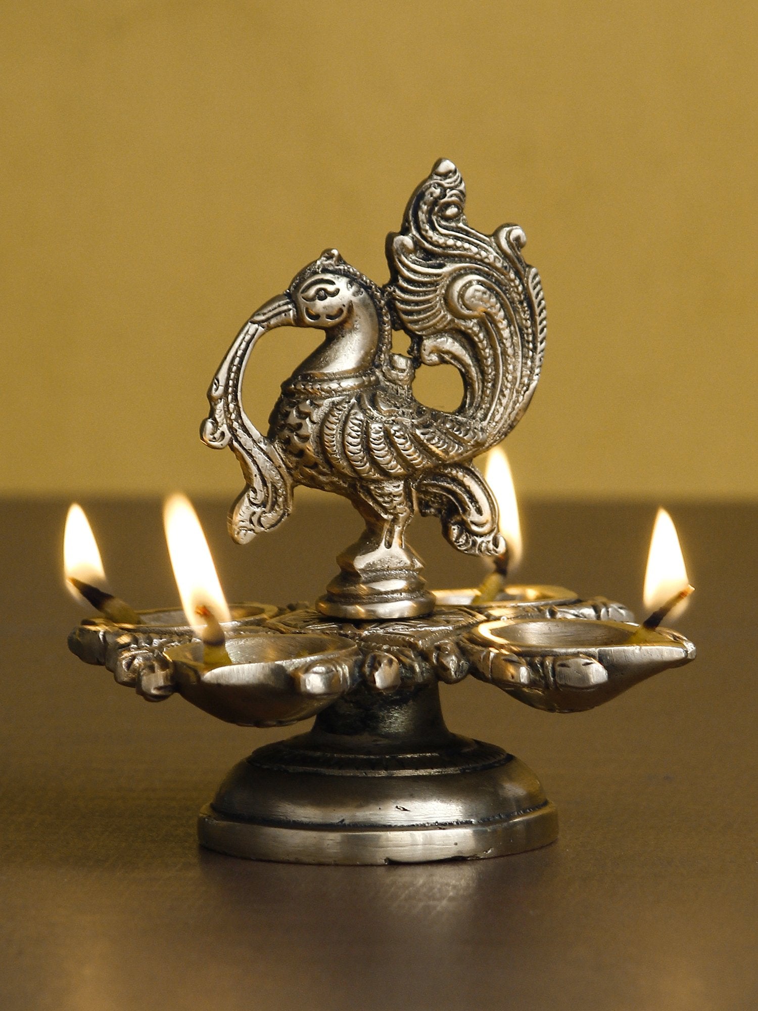 Golden Brass Decorative Handcrafted Peacock Showpiece with Diya for 4 Wicks