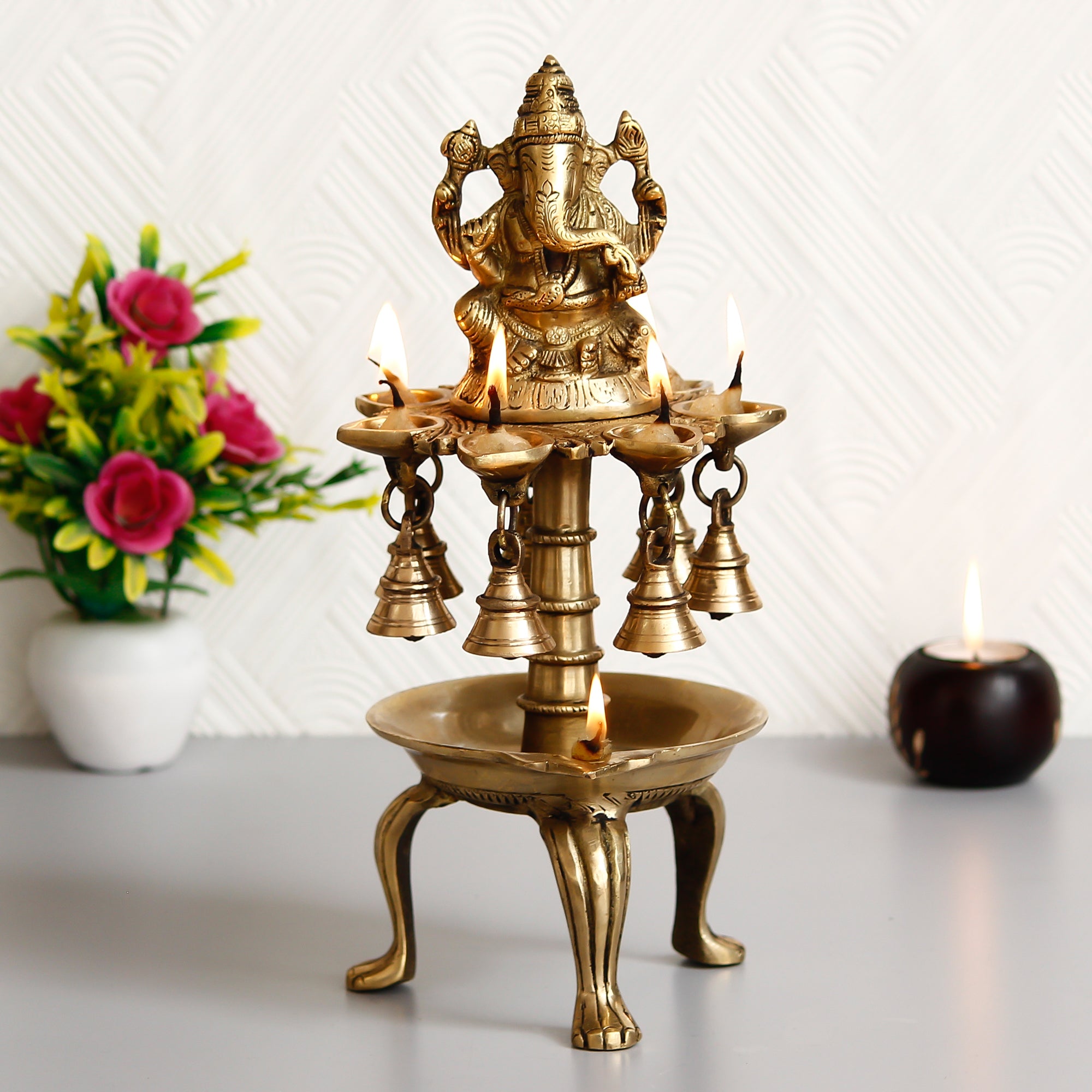 Golden Brass Handcrafted Lord Ganesha Idol with 8 Wicks Oil Diya and 7 Bells 1