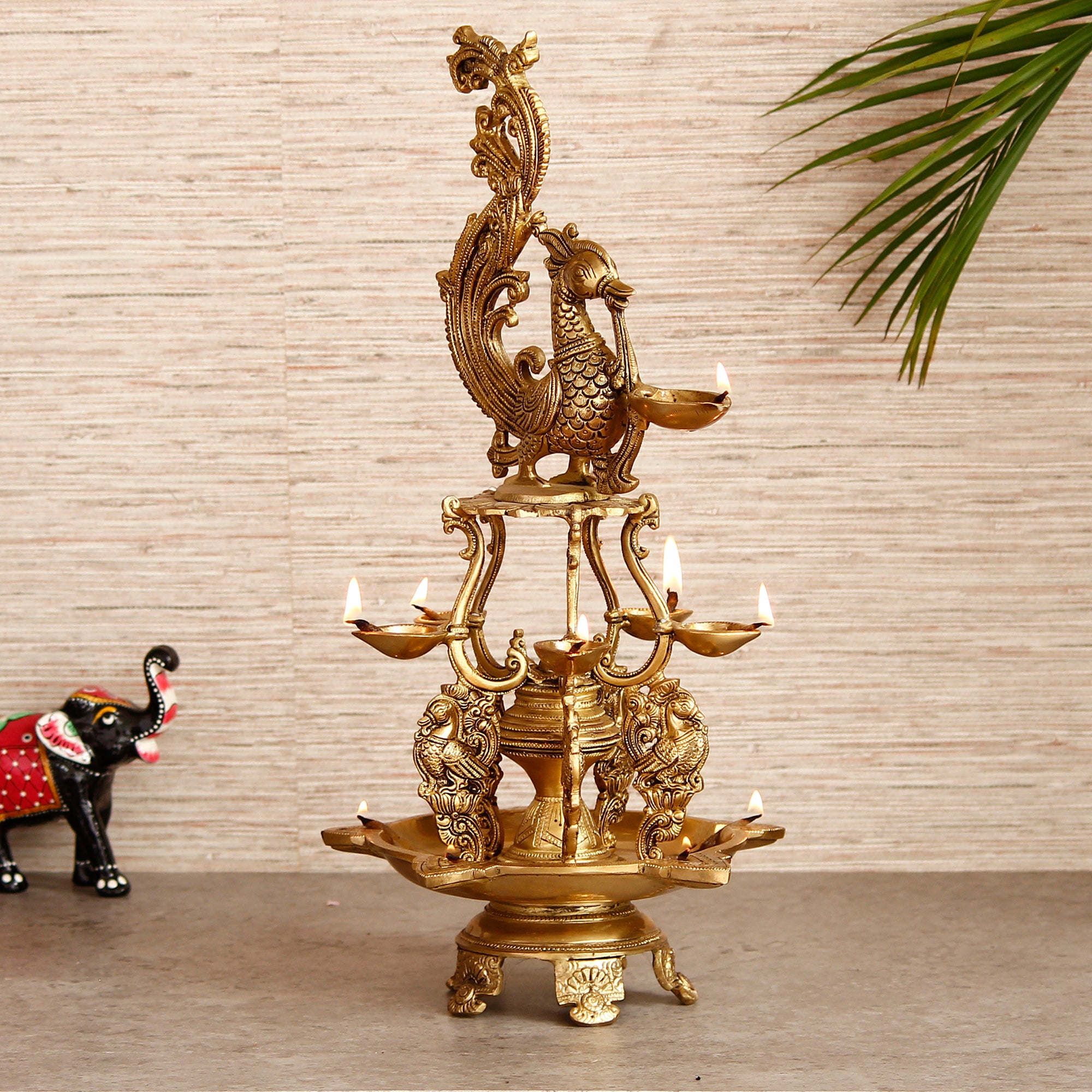 Golden Antique Finish Decorative Handcrafted Brass Peacock Showpiece with Brass Diyas for 11 Wicks and Stand