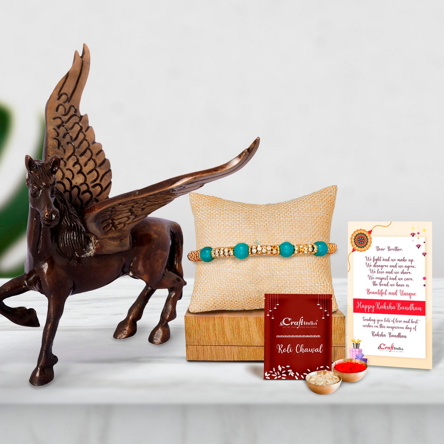 Designer Pearl Rakhi with Brass Antique Finish Flying Angel Horse and Roli Chawal Pack, Best Wishes Greeting Card