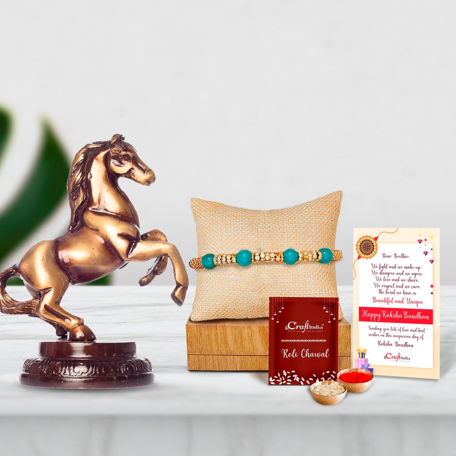 Designer Pearl Rakhi with Brass Horse Tableware Antique Showpiece and Roli Chawal Pack, Best Wishes Greeting Card
