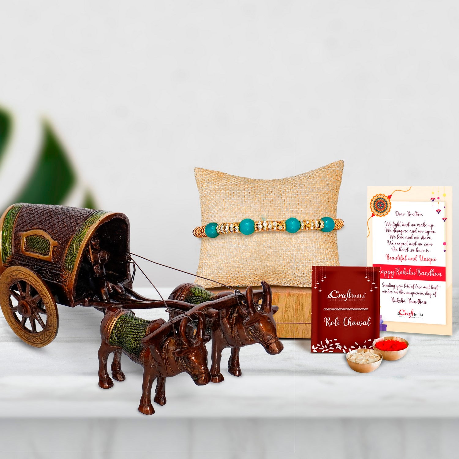 Designer Pearl Rakhi with Brass Brown and Green Antique Finish Closed Bullock Cart  and Roli Chawal Pack, Best Wishes Greeting Card