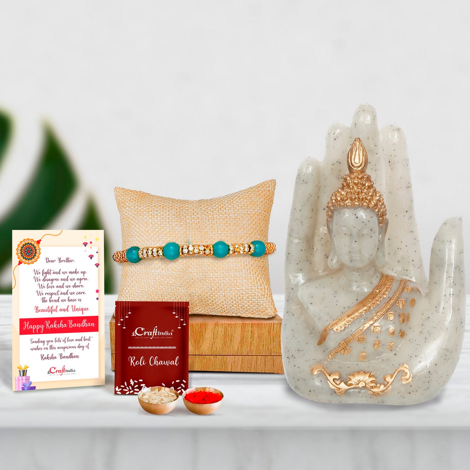 Designer Pearl Rakhi with Golden Silver Handcrafted Palm Buddha Showpiece and Roli Chawal Pack, Best Wishes Greeting Card