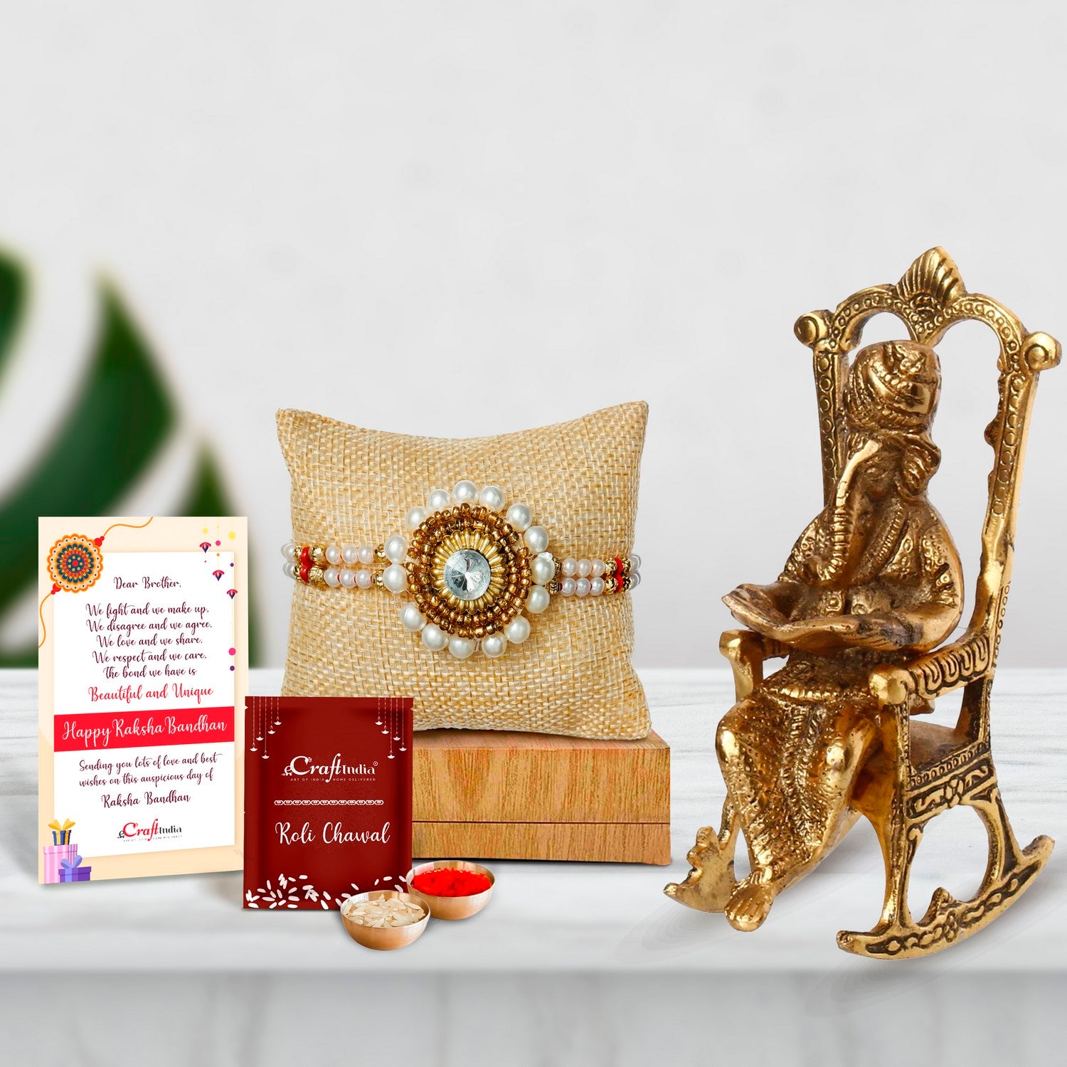 Designer Handcrafted Stone Pearl Rakhi with Lord Ganesha on Rocking Chair Antique Showpiece and Roli Chawal Pack, Best Wishes Greeting Card