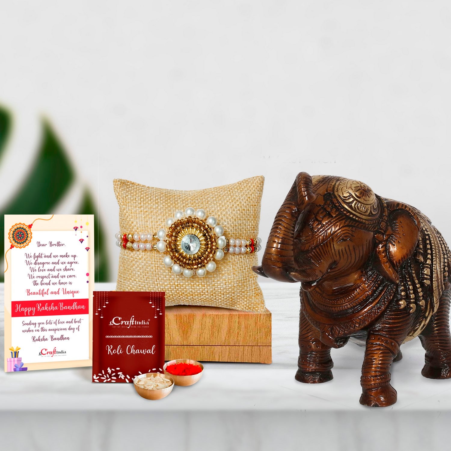 Designer Handcrafted Stone Pearl Rakhi with Antique Finish Decorative Brass Elephant Fingurine and Roli Chawal Pack, Best Wishes Greeting Card