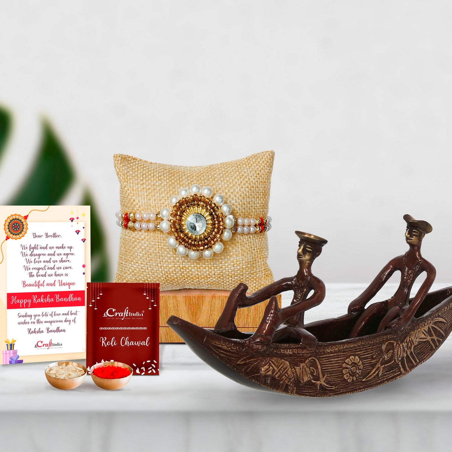 Designer Handcrafted Stone Pearl Rakhi with Antique Finish 2 Men in Boat Brass Decorative Showpiece and Roli Chawal Pack, Best Wishes Greeting Card
