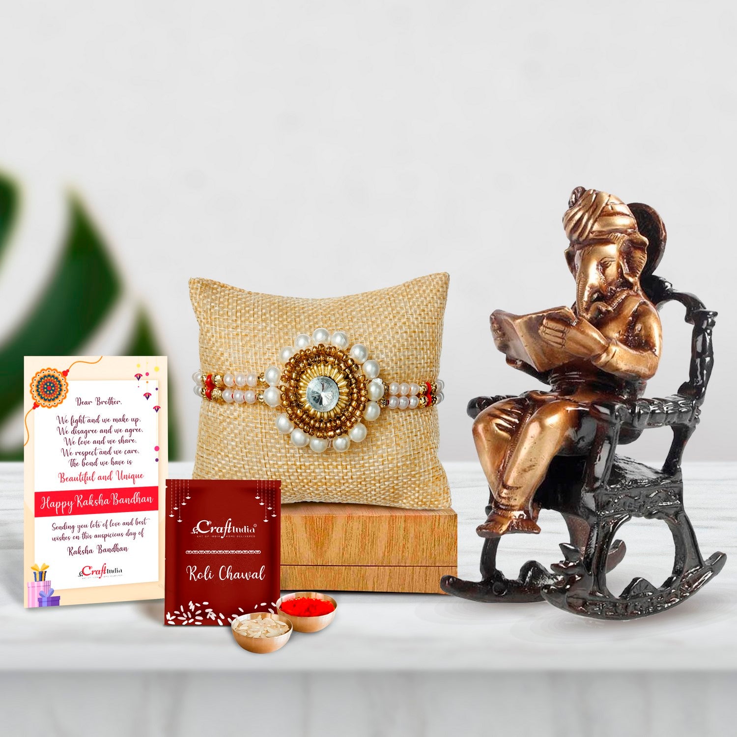 Designer Handcrafted Stone Pearl Rakhi with Brass Lord Ganesha on Rocking Chair Antique Showpiece and Roli Chawal Pack, Best Wishes Greeting Card