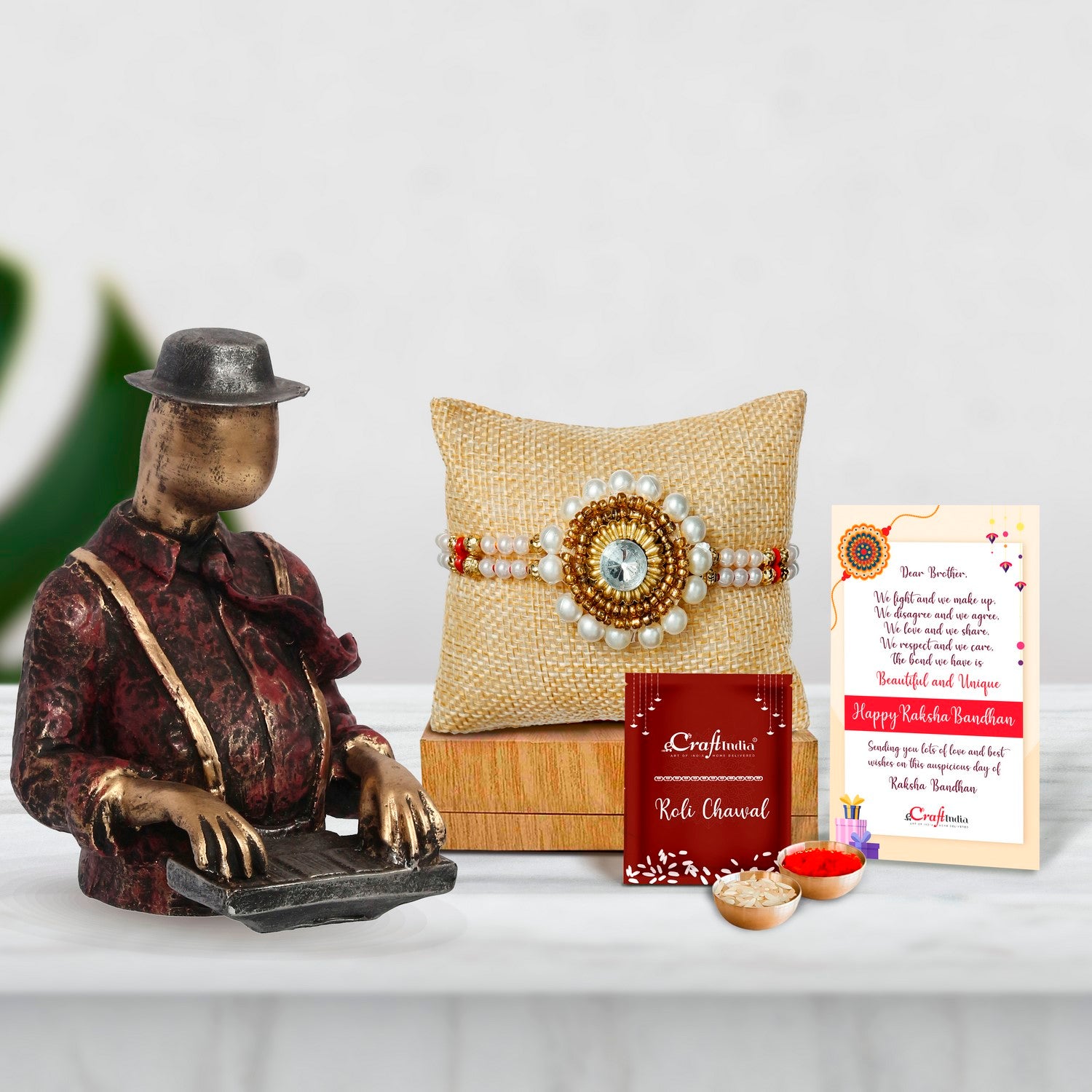 Designer Handcrafted Stone Pearl Rakhi with Man with Hat playing Piano Decorative Statue and Roli Chawal Pack, Best Wishes Greeting Card