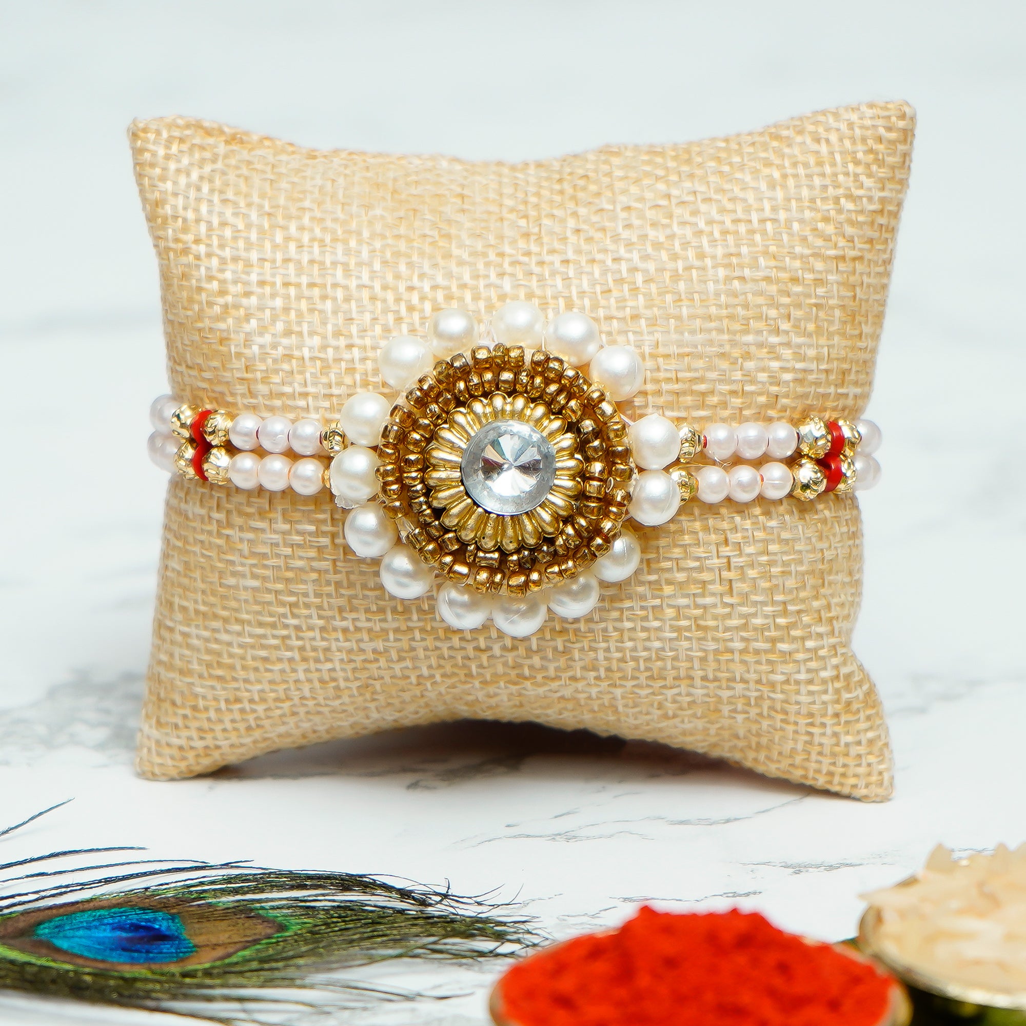 Designer Handcrafted Stone Pearl Rakhi with Golden Handcrafted Palm Buddha Decorative Showpiece with Wooden Base, Fragranced Petals and Tealight and Roli Chawal Pack, Best Wishes Greeting Card 1
