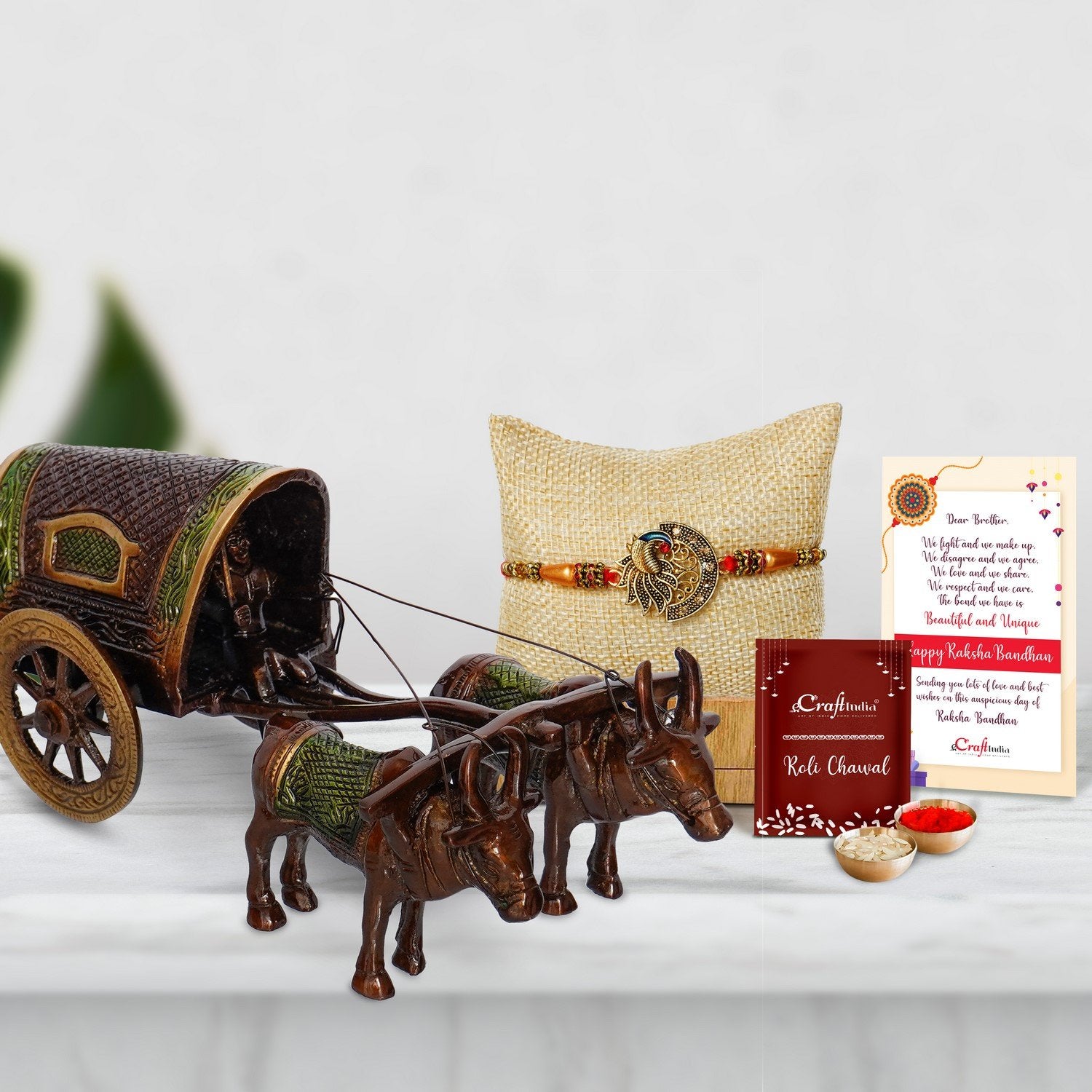 Designer Peacock Rakhi with Brass Brown and Green Antique Finish Closed Bullock Cart  and Roli Chawal Pack, Best Wishes Greeting Card