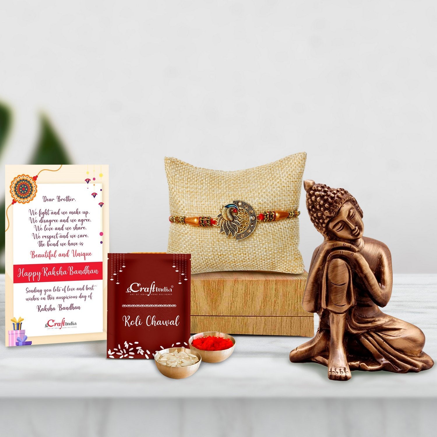 Designer Peacock Rakhi with Brass Buddha Resting Antique Artifact and Roli Chawal Pack, Best Wishes Greeting Card