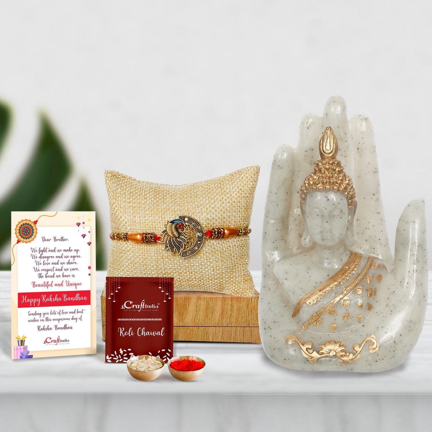 Designer Peacock Rakhi with Golden Silver Handcrafted Palm Buddha Showpiece and Roli Chawal Pack, Best Wishes Greeting Card