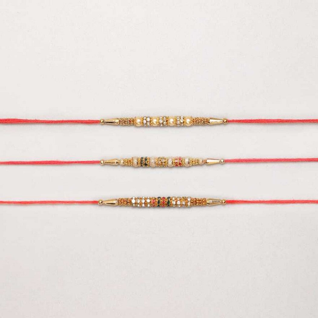 eCraftIndia Set of 3 Pearls, Diamonds Designer Rakhis with Red Thread, and Roli Chawal Pack 1