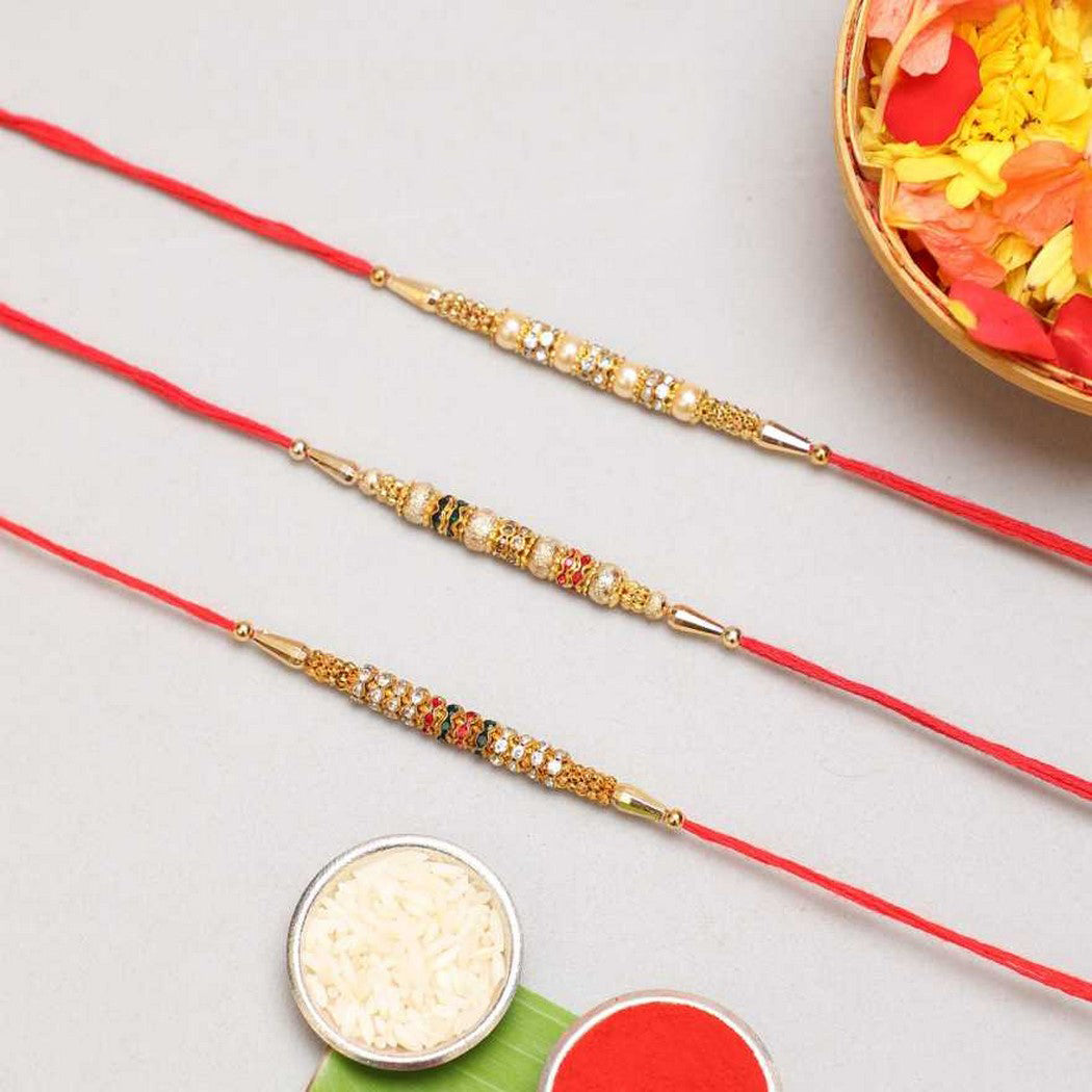 eCraftIndia Set of 3 Pearls, Diamonds Designer Rakhis with Red Thread, and Roli Chawal Pack 2