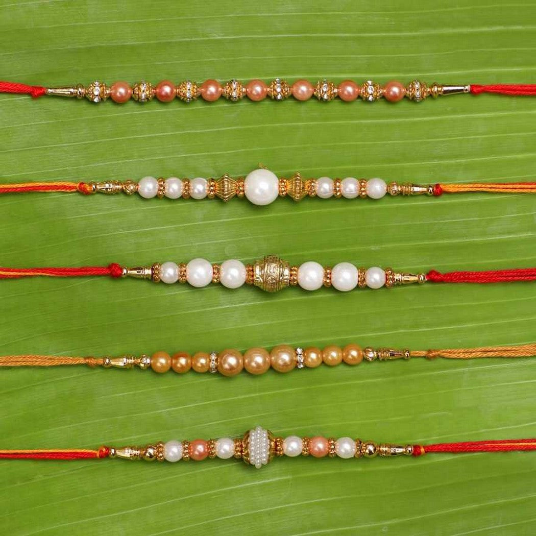 eCraftIndia Set of 5 White & Golden Pearls Rakhis with Roli Chawal Pack 2