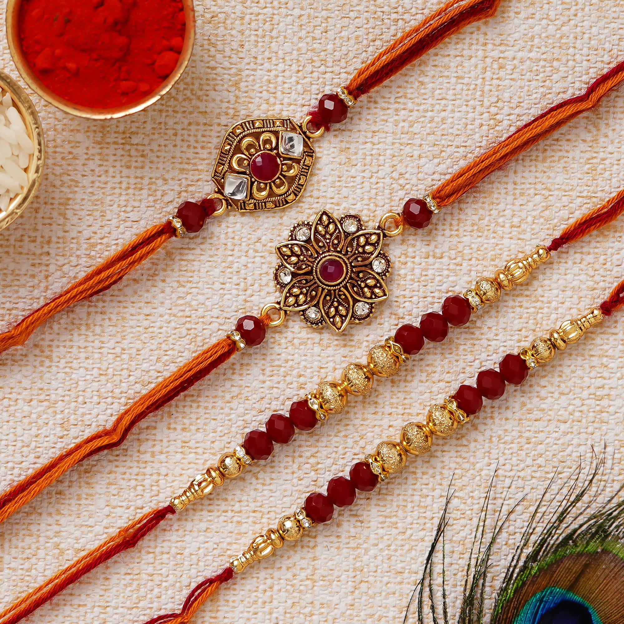 Red & Golden Pack of 4 Designer Rakhis and Roli Chawal Pack