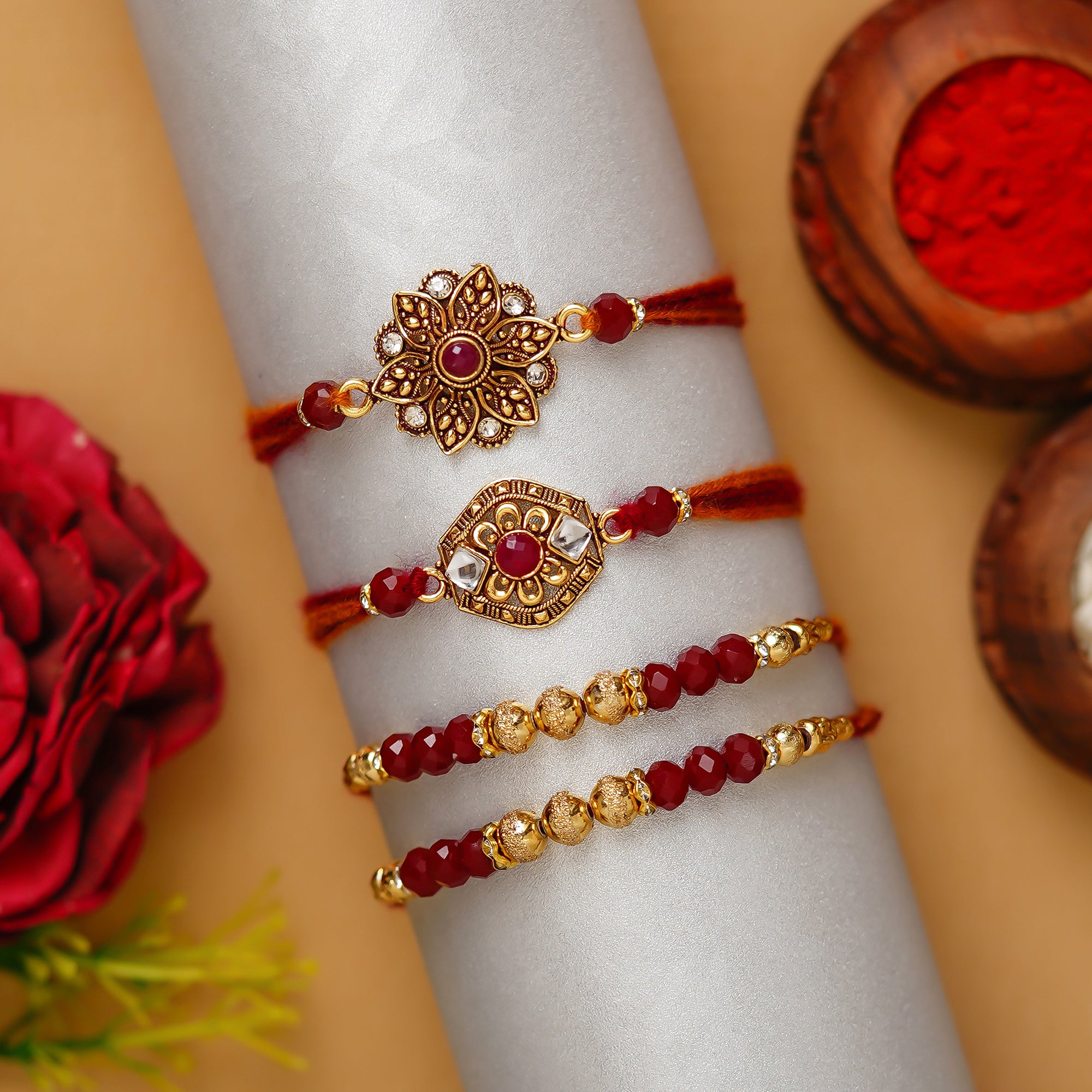 Red & Golden Pack of 4 Designer Rakhis and Roli Chawal Pack 1