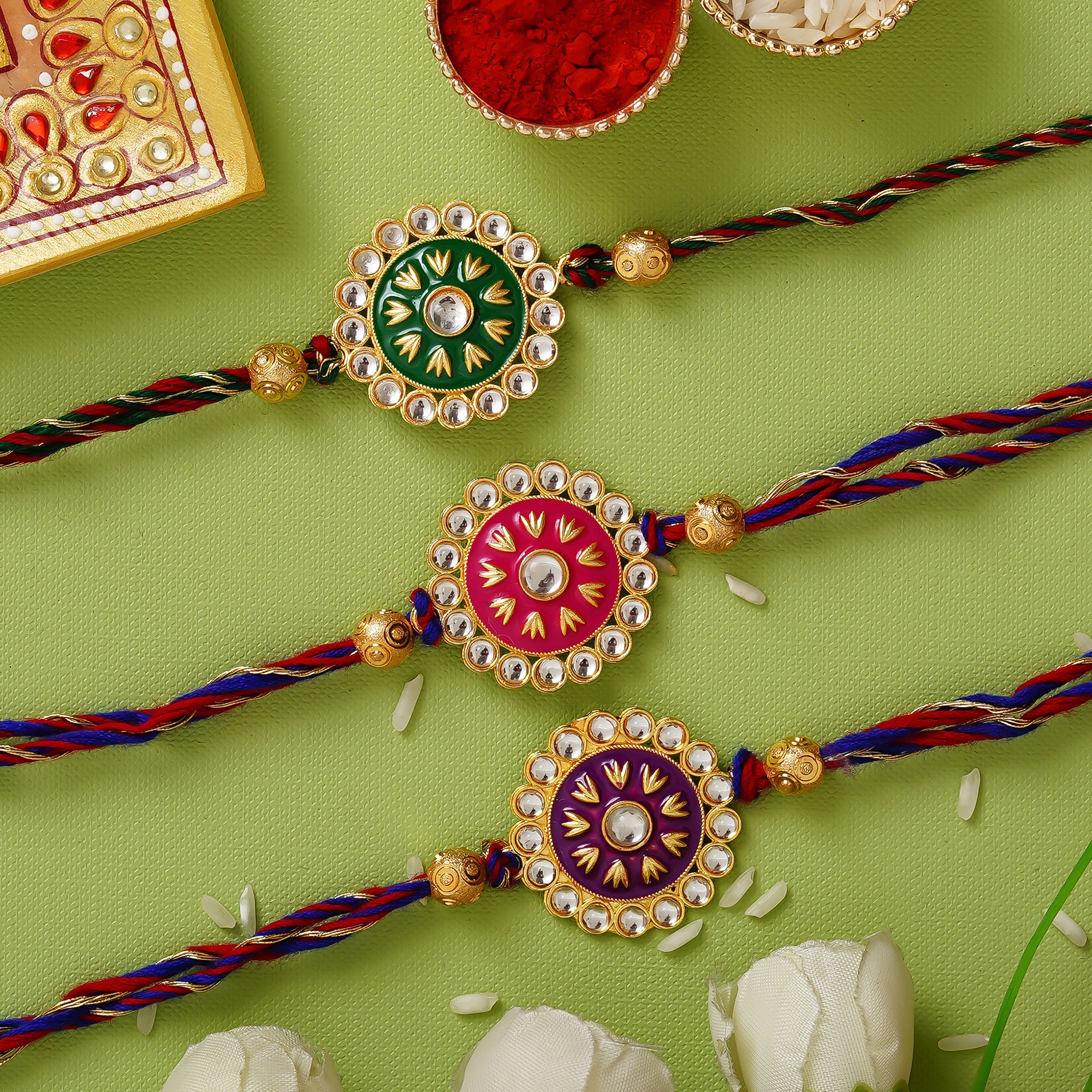 Red, Green & Maroon Pack of 3 Meenakari Designer Rakhis and Roli Chawal Pack