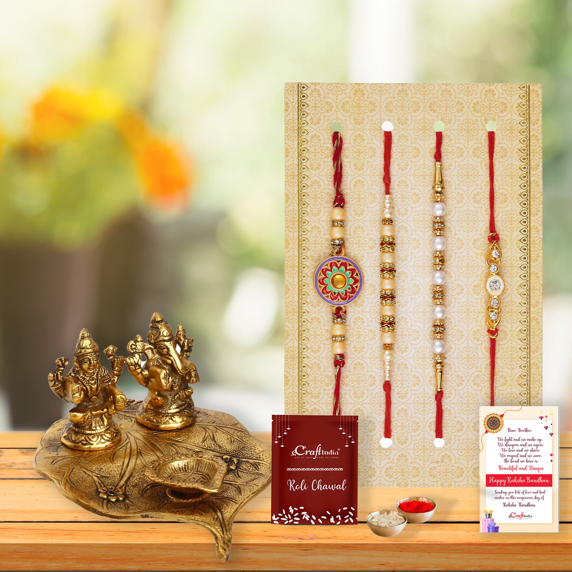 Set of 4 Designer Pearl Rakhis with Golden Goddess Lakshmi and Lord Ganesha Idols with Decorative Diya, Roli Chawal Pack, Raksha Bandhan Greeting Card