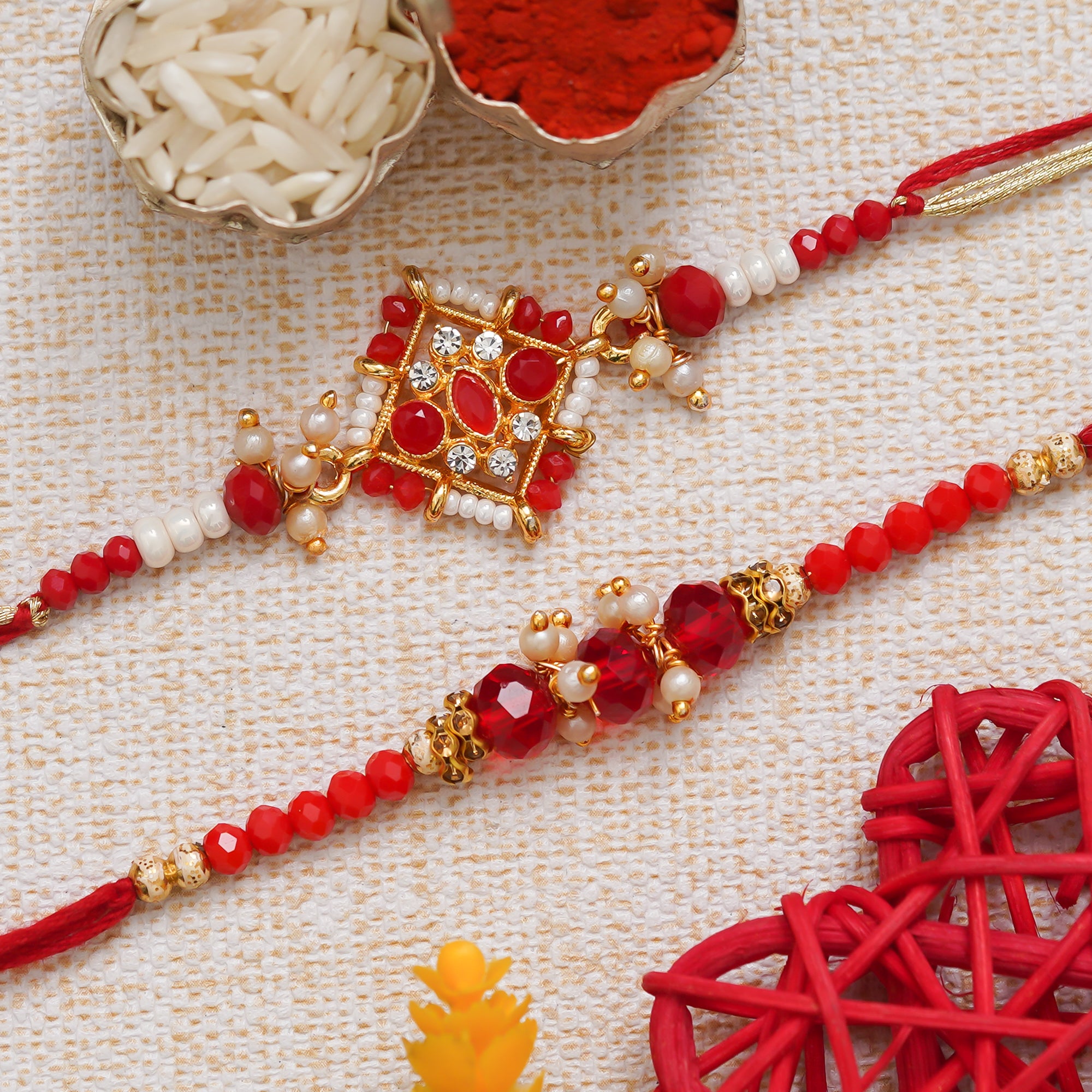 eCraftIndia Golden, Red & White Set of 2 Precious Stone Designer Rakhis with Roli Chawal Pack 1