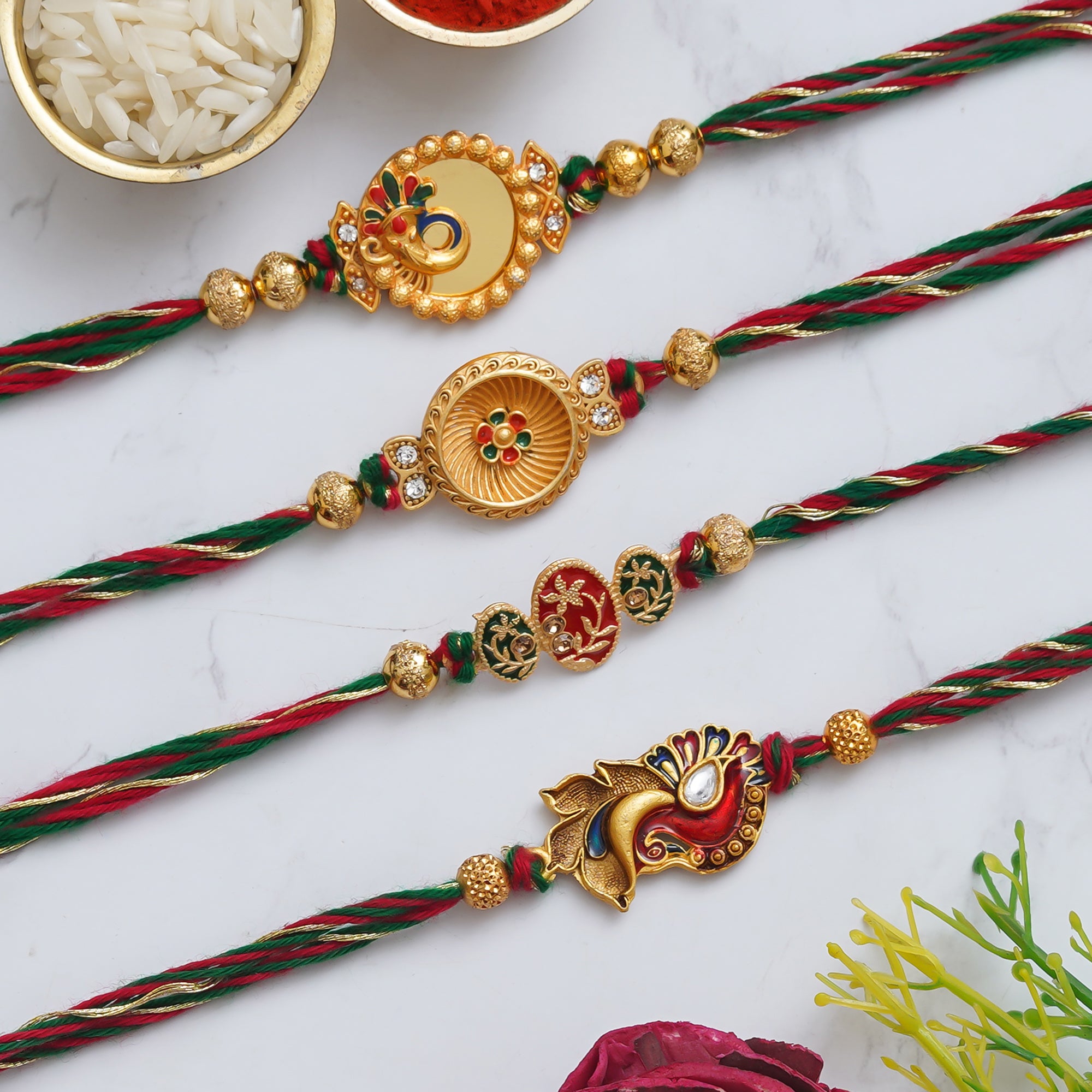 eCraftIndia Multicolor Set of 4 Ganesha, Peacock, Flowers Designer Rakhis with Roli Chawal Pack