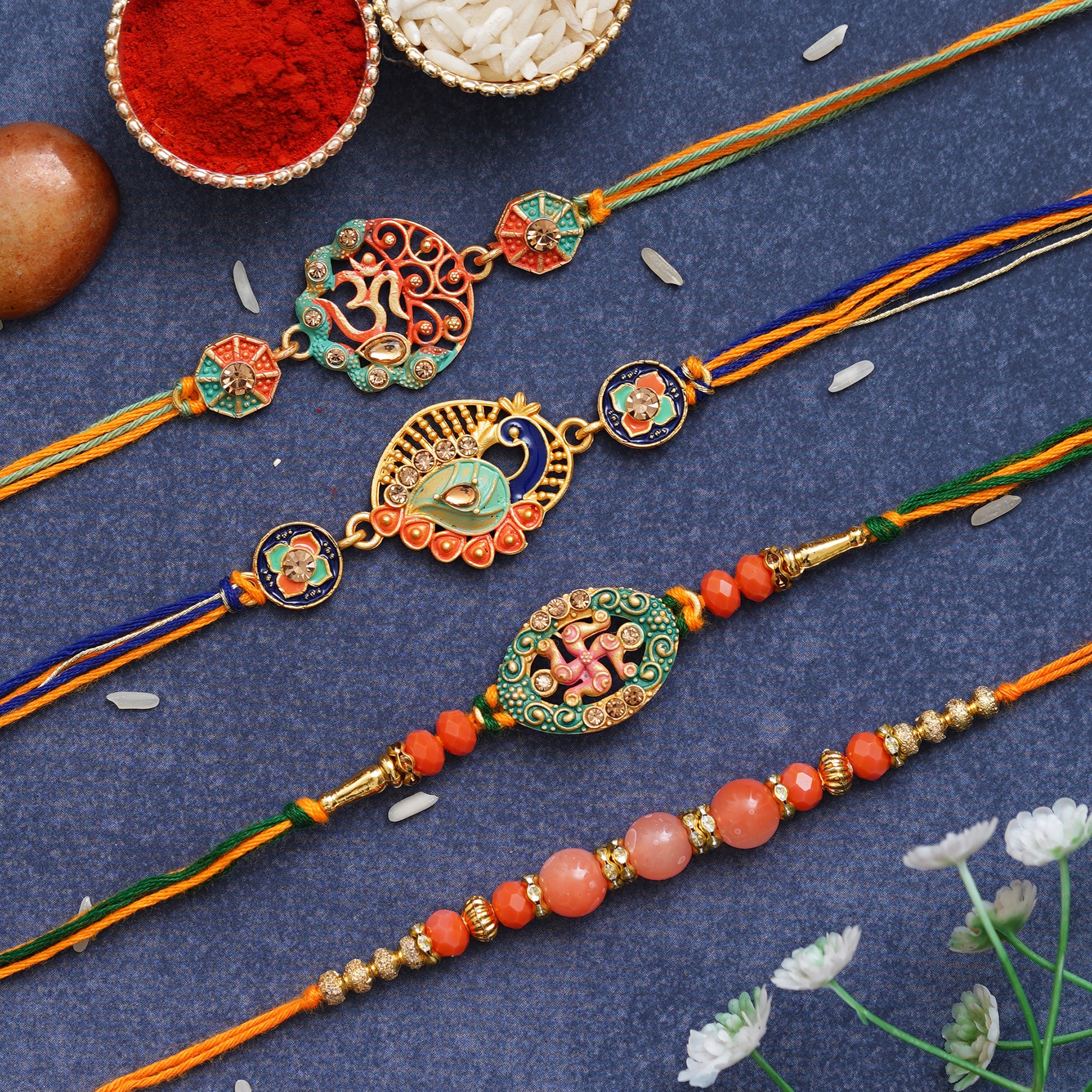 Set of 4 Om, Swastika, Peacock, Pearls, Designer Rakhis with Roli Chawal Pack