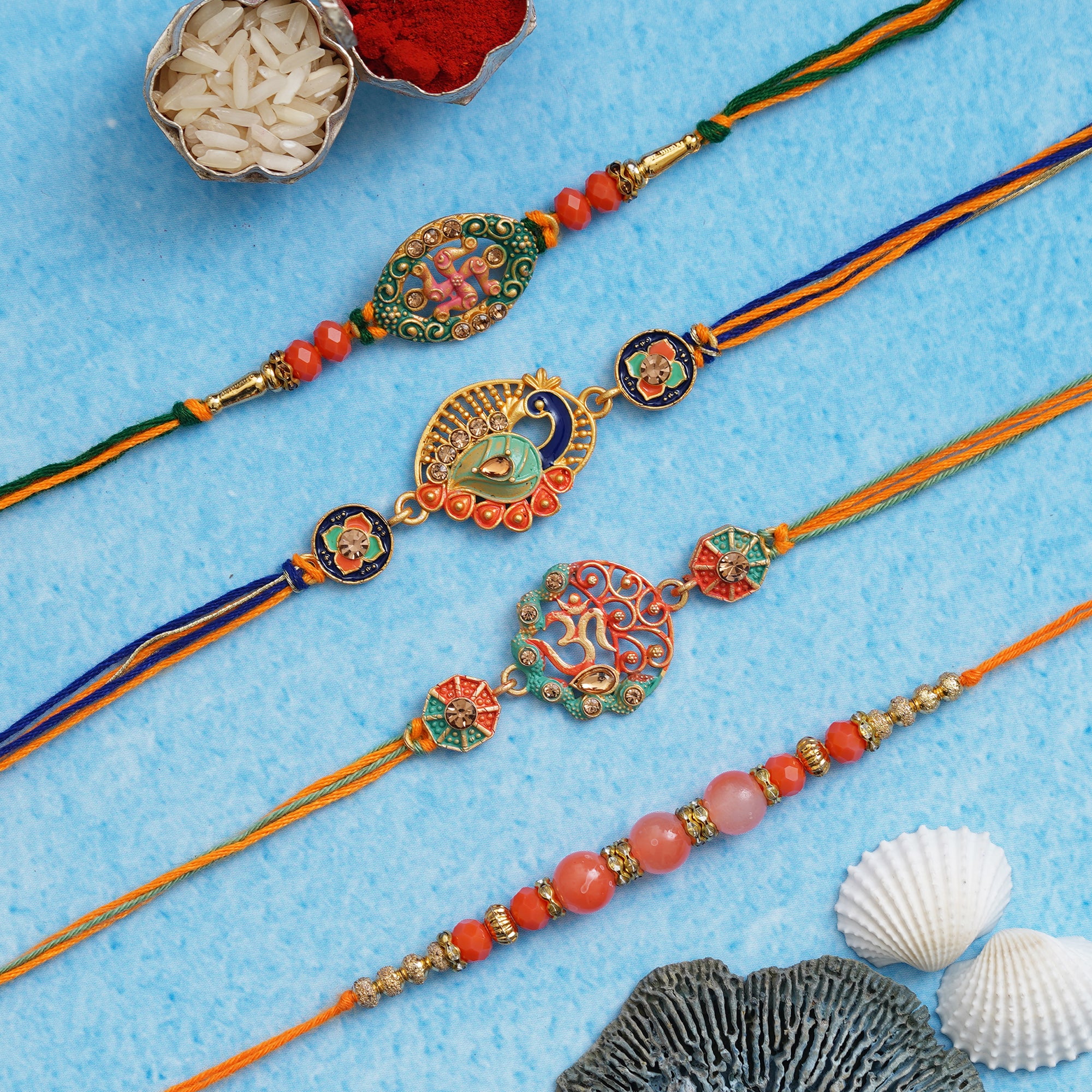 Set of 4 Om, Swastika, Peacock, Pearls, Designer Rakhis with Roli Chawal Pack 1