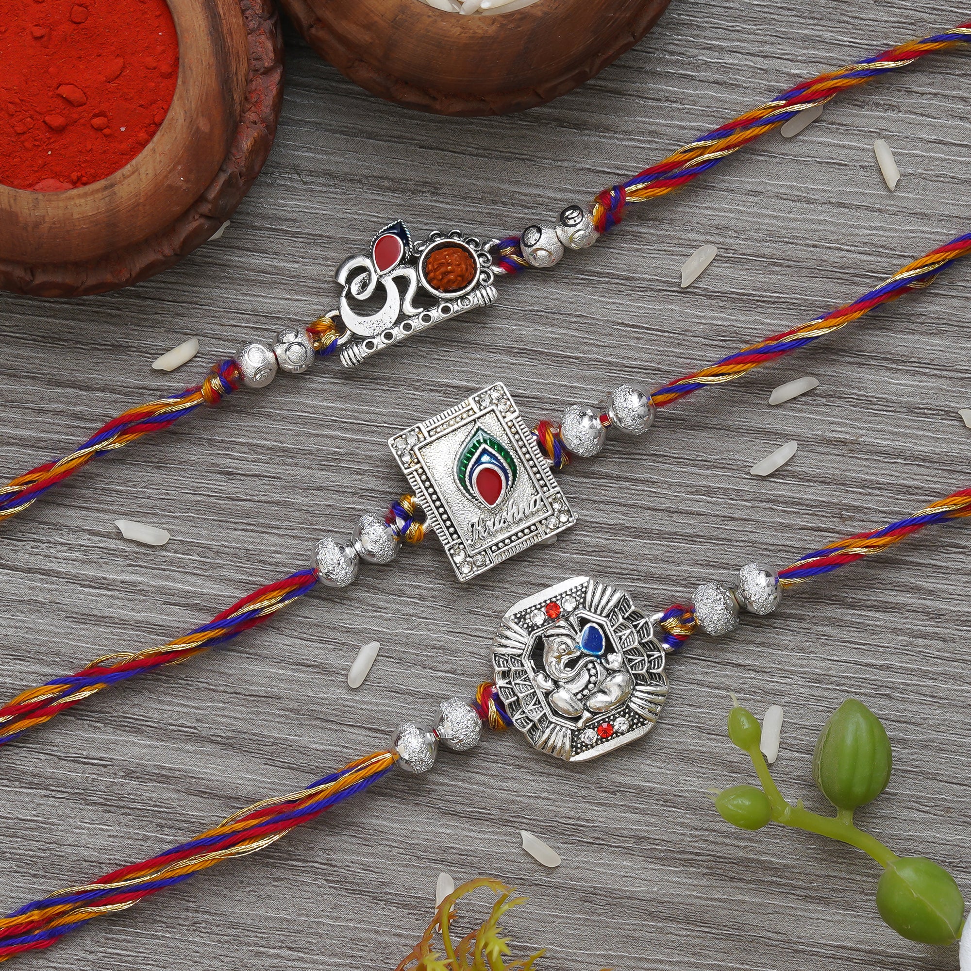Set of 3 Om, Krishna with Peacock Feather, Lord Ganesha Silver Religious Designer Rakhis with Roli Chawal Pack
